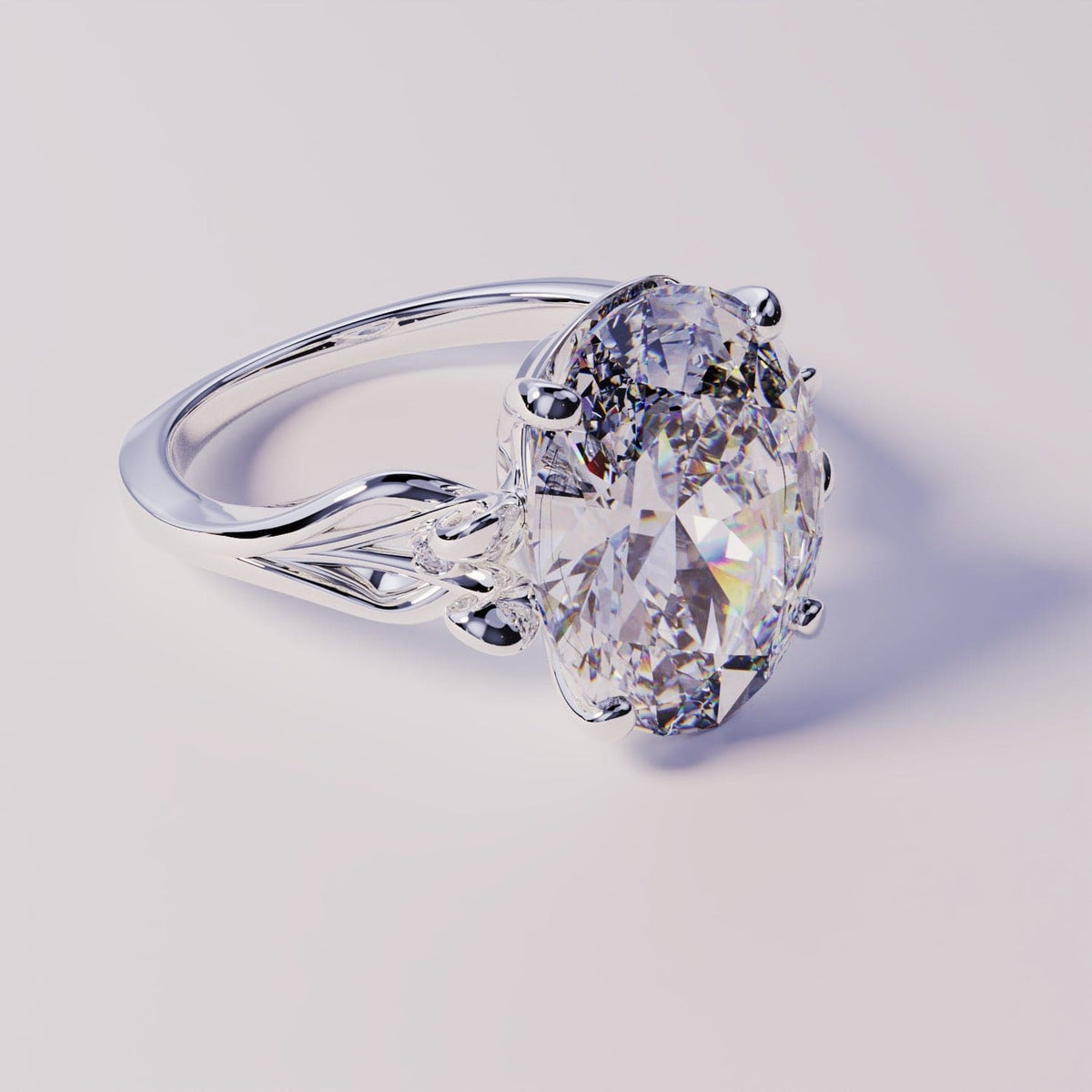 Silver-toned ring featuring an ornate filigree band and a large oval-cut clear gemstone.
