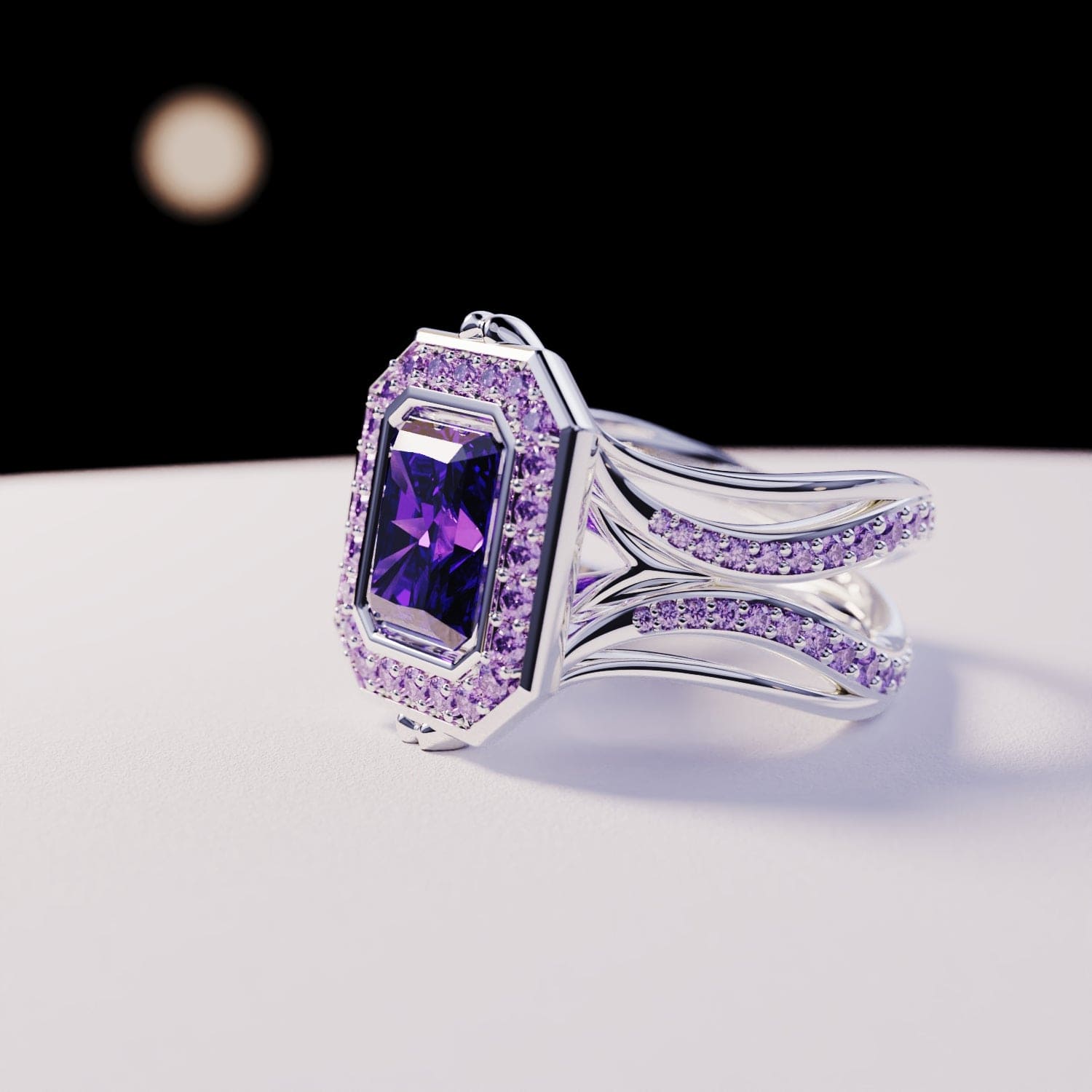 Silver-toned ring with a central rectangular purple gem framed by small light purple stones on a split band.