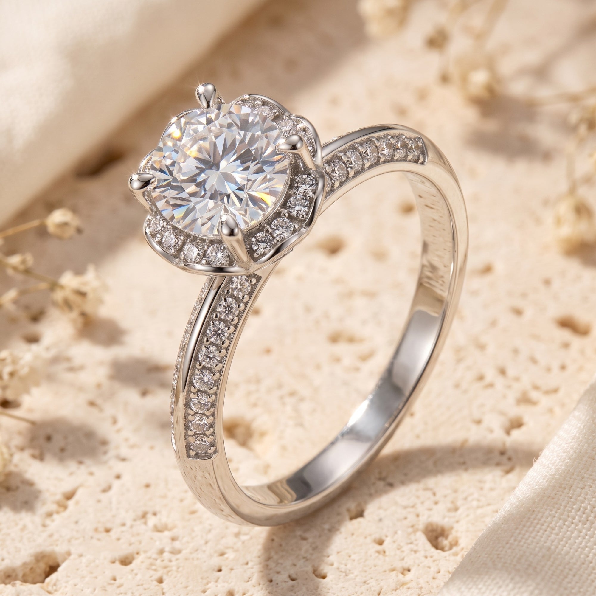 Silver Fleur Bloom ring with round brilliant simulated diamond on textured stone.