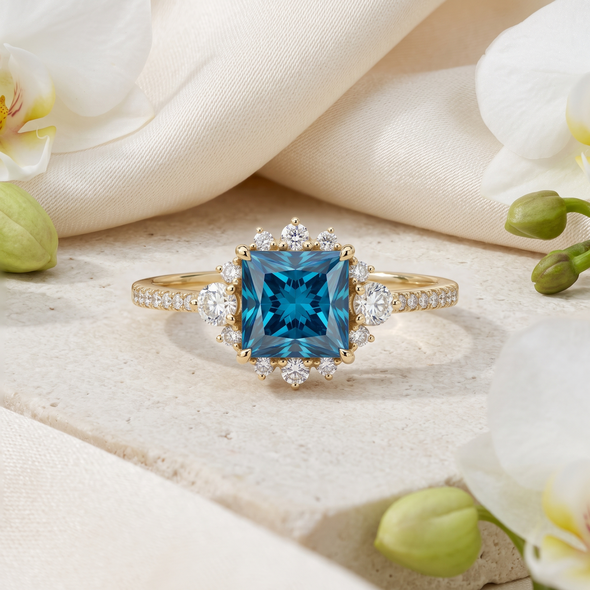 Princess cut blue moissanite engagement ring with diamond halo in yellow gold