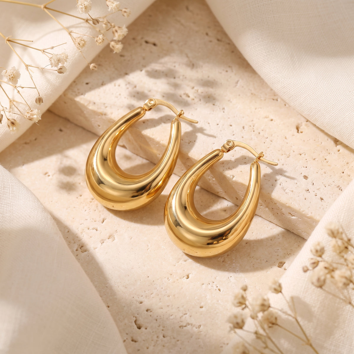 Boucles d’oreilles sculptées en forme de goutte