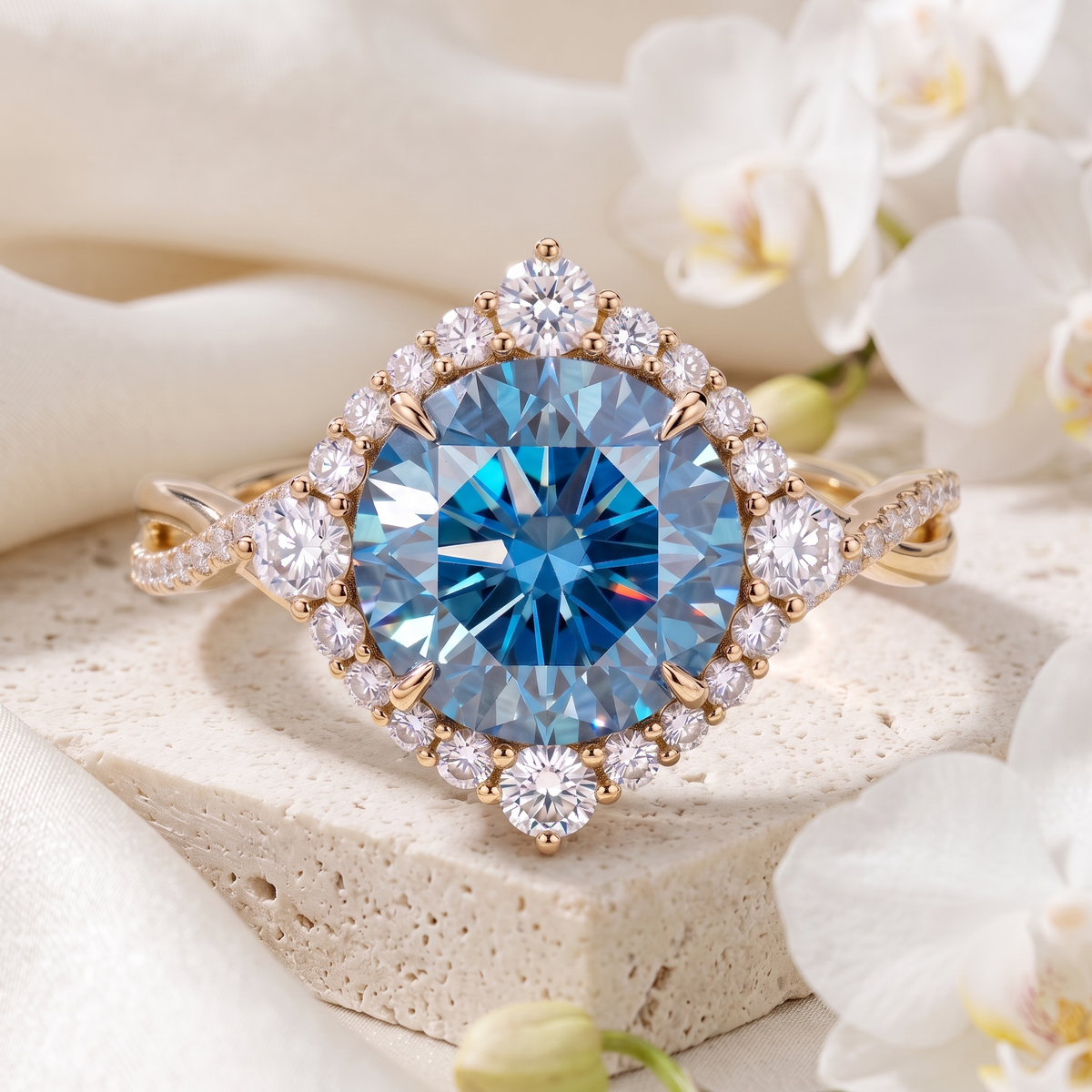 Front view of a round blue moissanite halo ring in yellow gold with a twisted pavé band.
