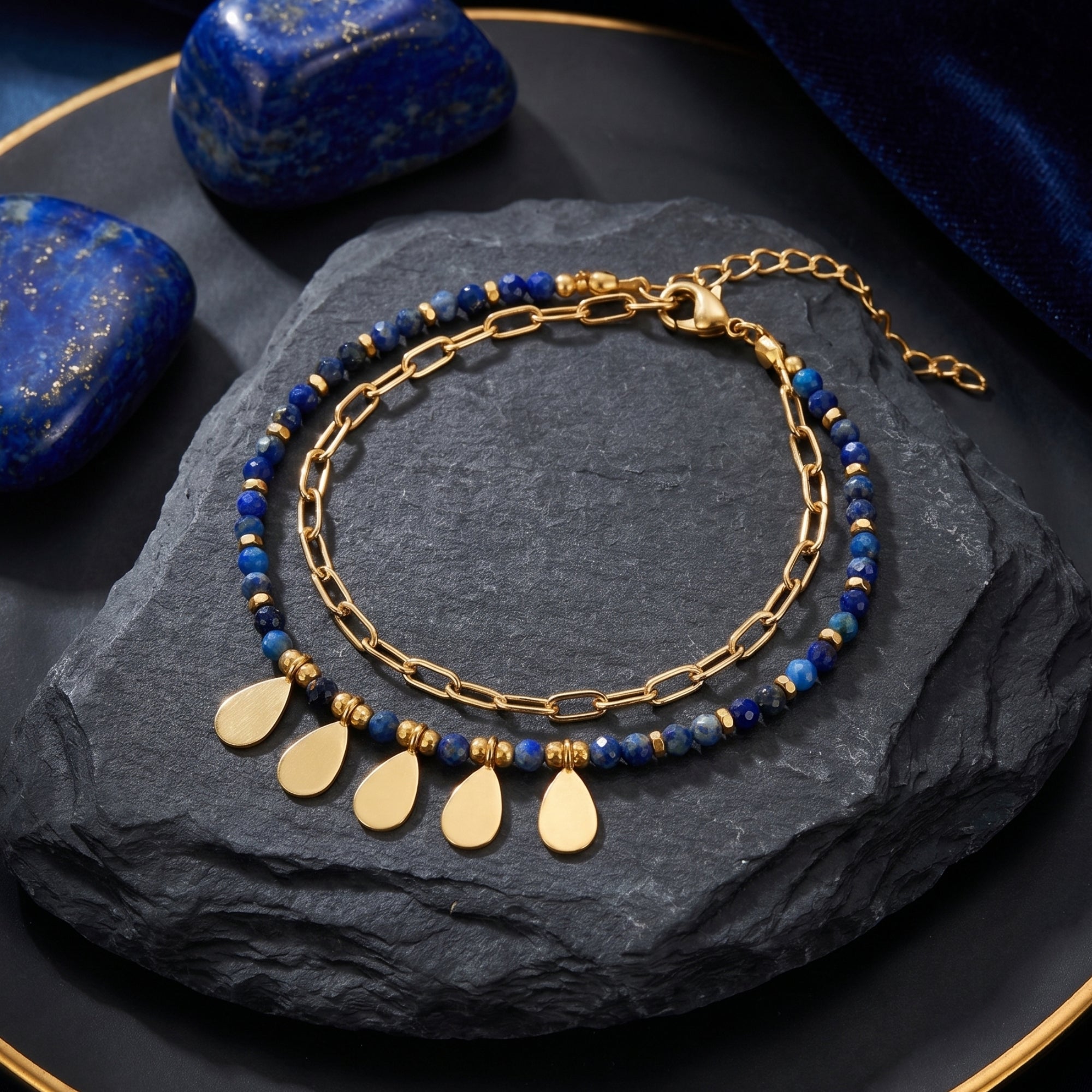 Top-down view of the Sylvan Leaf double-layered gold plated bracelet with faceted lapis beads and leaf charms.