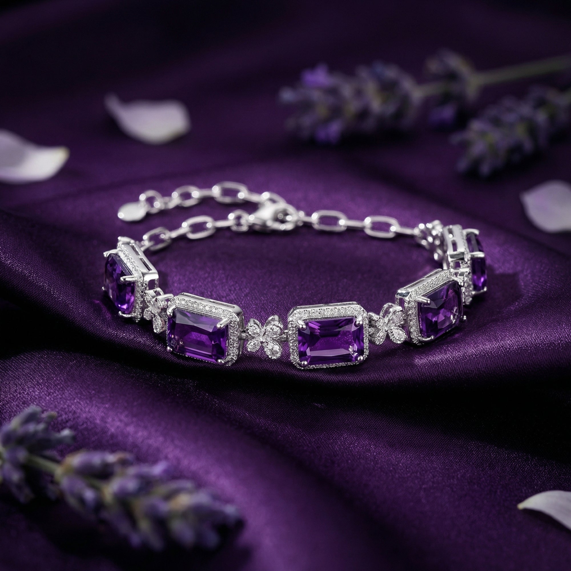 S925 sterling silver station bracelet with square cut amethysts on purple silk with lavender sprigs.