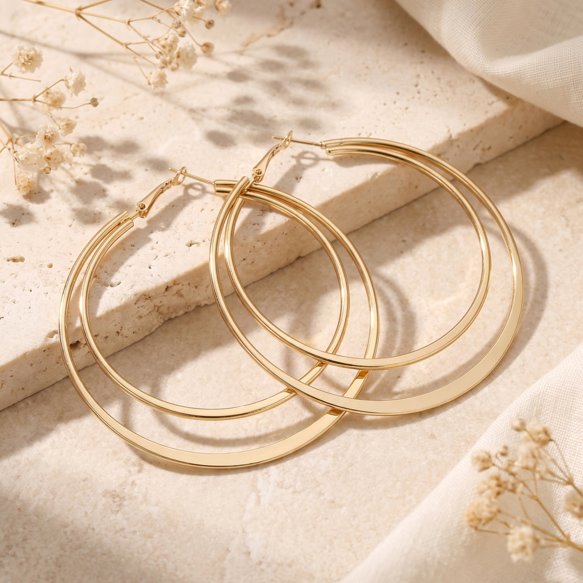 Les boucles d’oreilles créoles doubles Orbit