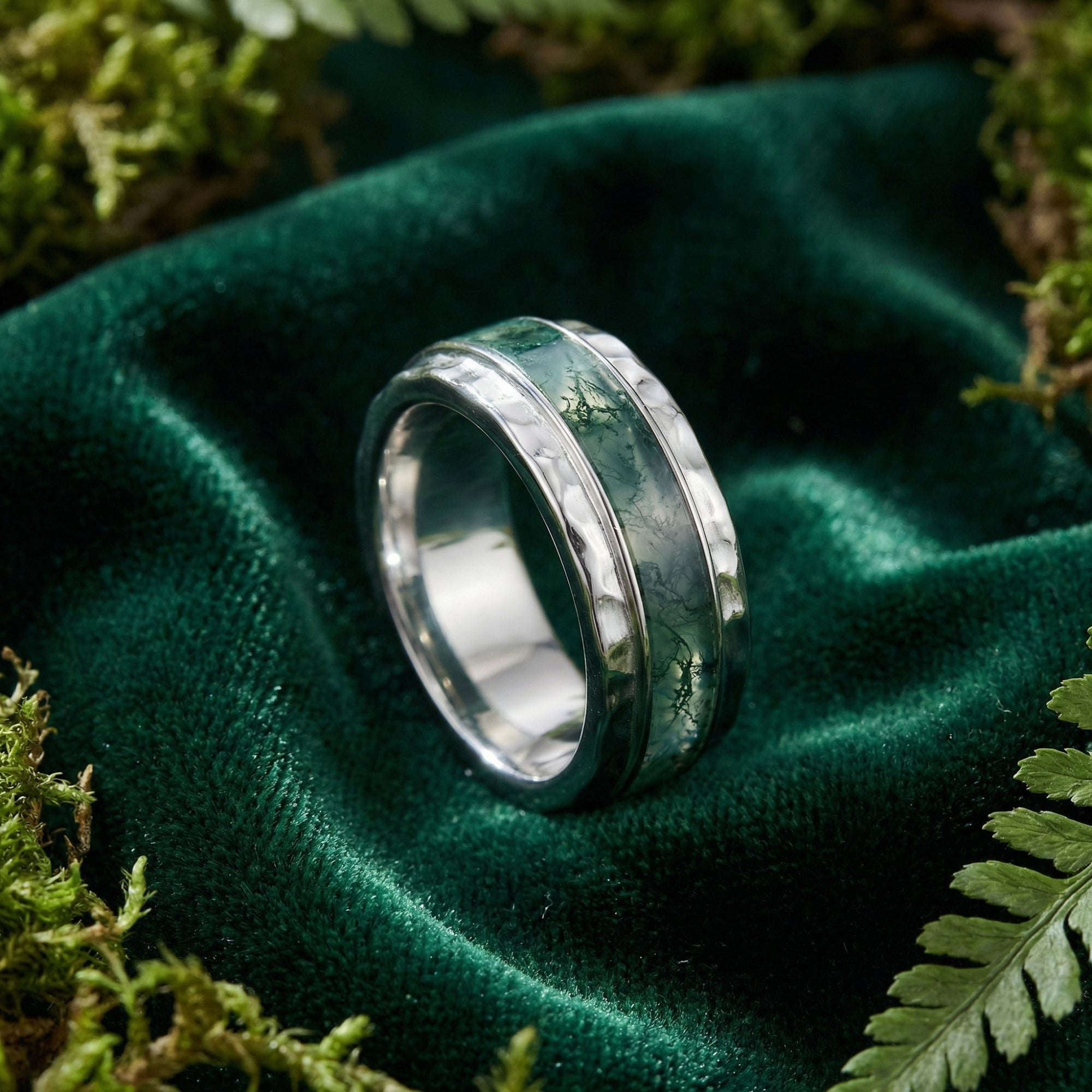 Natural moss agate inlay band ring in S925 sterling silver on green velvet with forest moss.