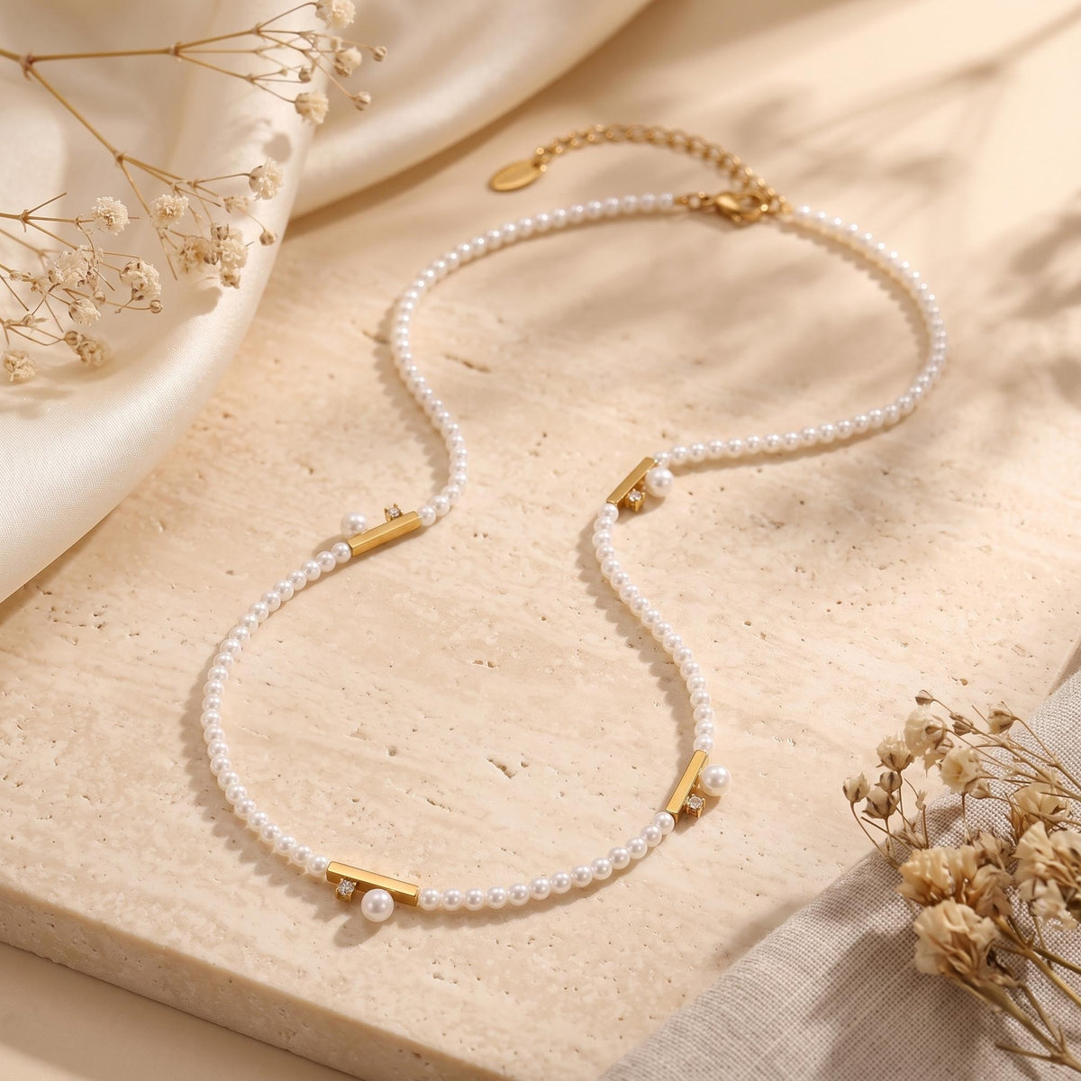 Le collier station à barre de perles