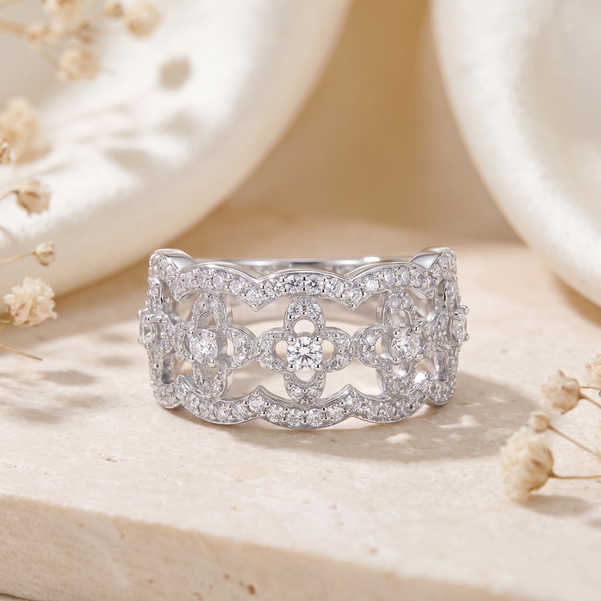 S925 sterling silver clover lattice promise ring with simulated diamonds on stone with floral accents.