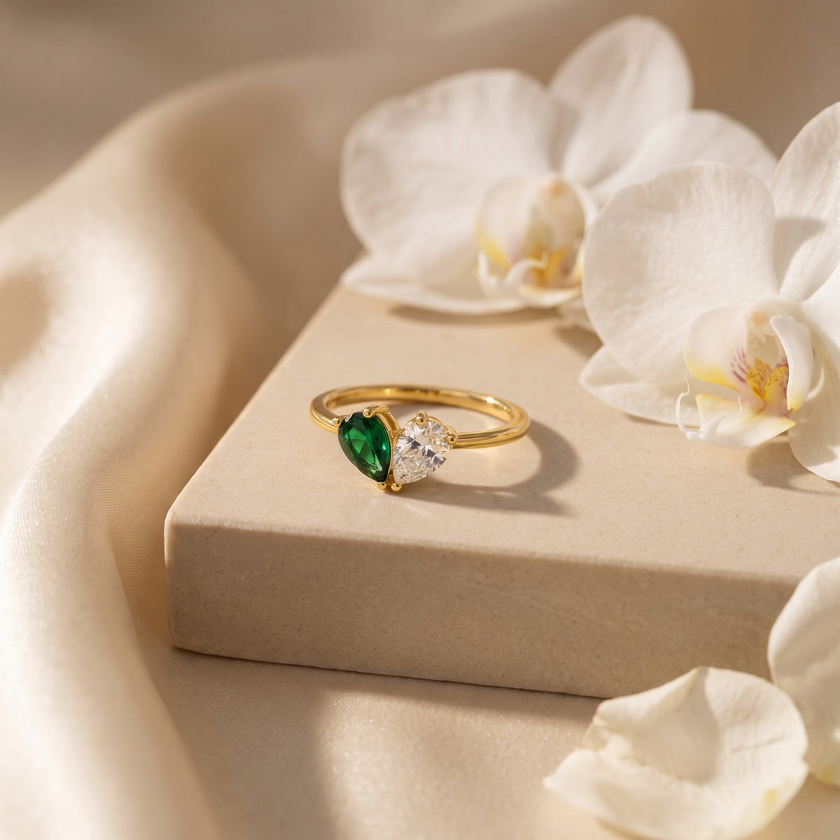 Gold-tone pear-stone heart ring with green and clear example stones