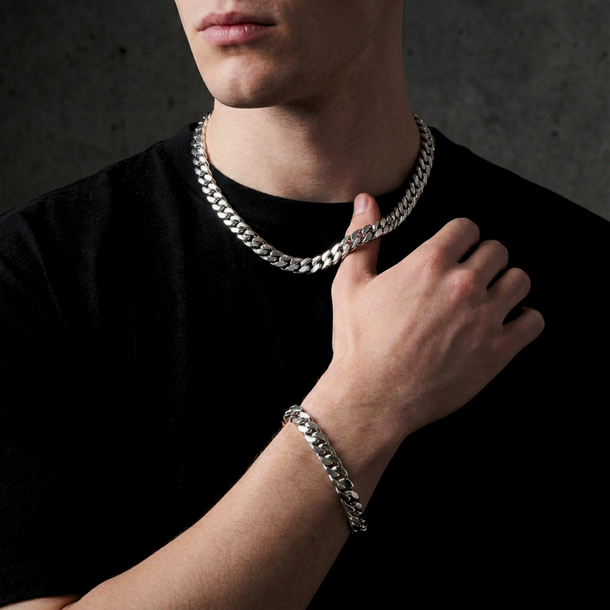 Man wearing the silver stainless steel Spartan Cuban chain and matching bracelet set.