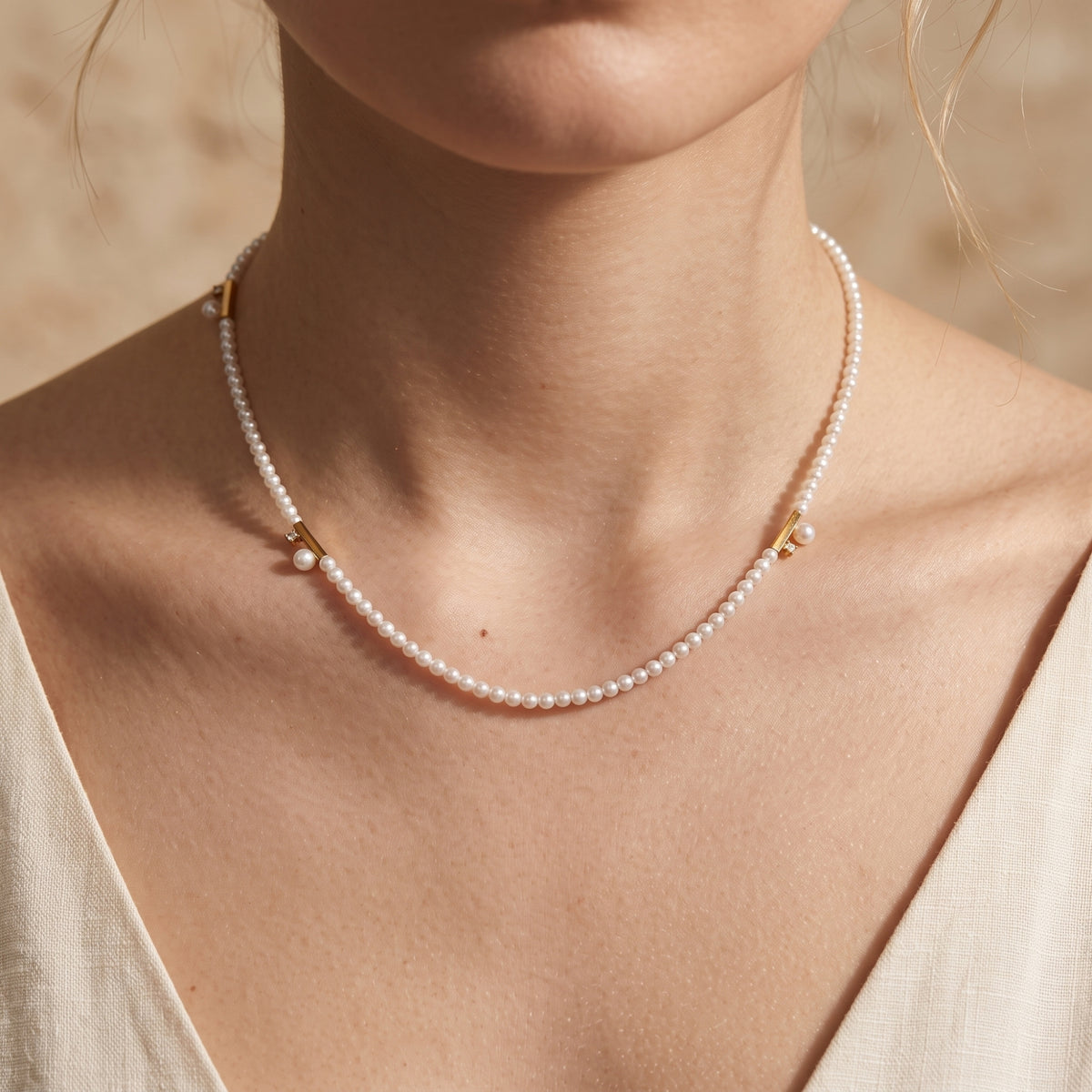 Le collier station à barre de perles