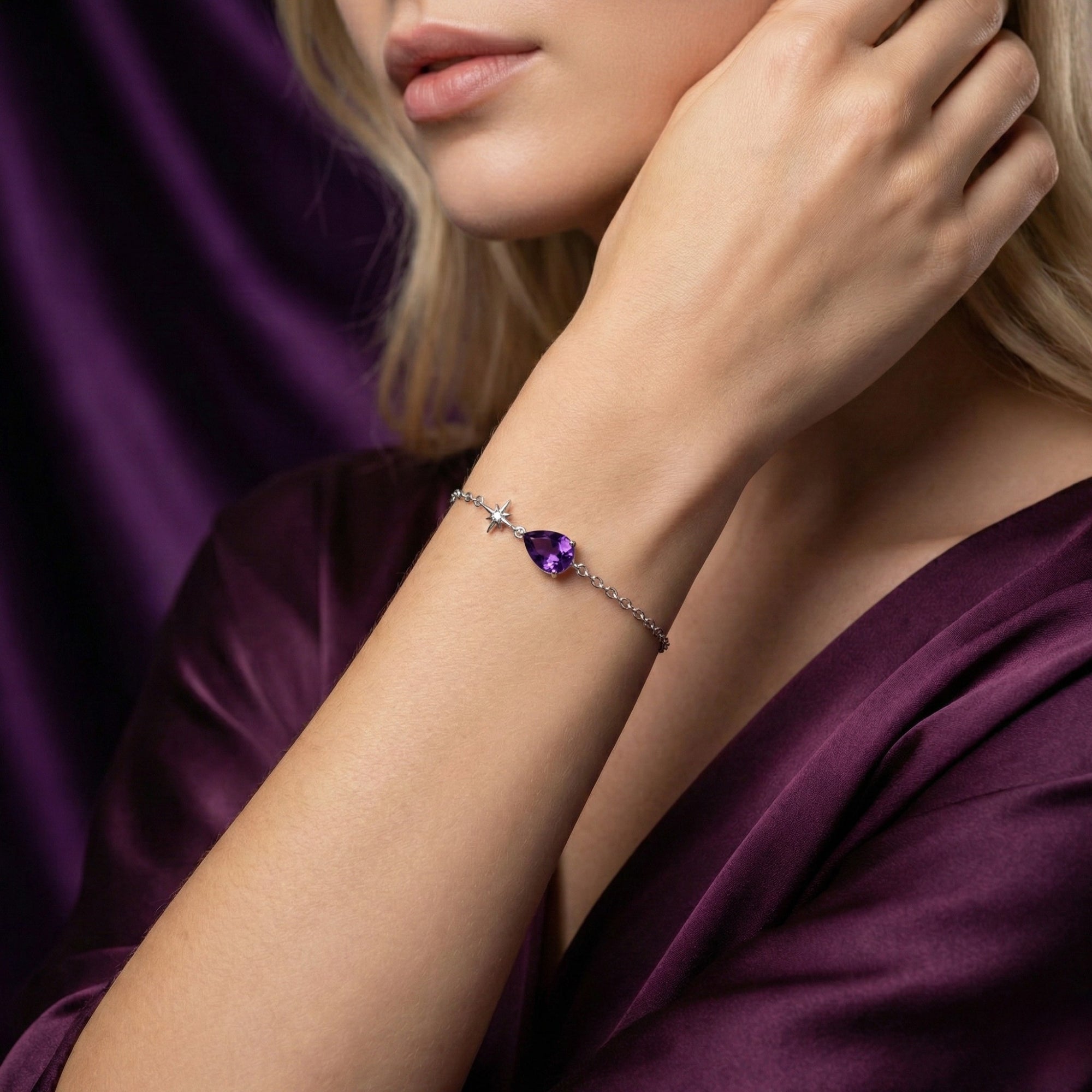Woman wearing the Sylphina pear cut amethyst bracelet in sterling silver on her wrist.
