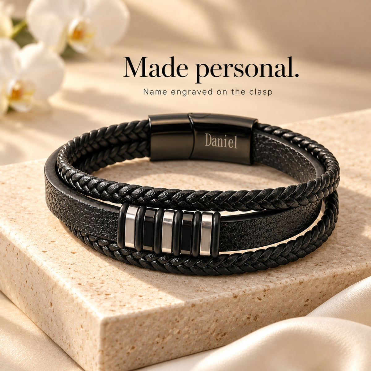 Close view of the braided bracelet and optional sample Daniel clasp engraving