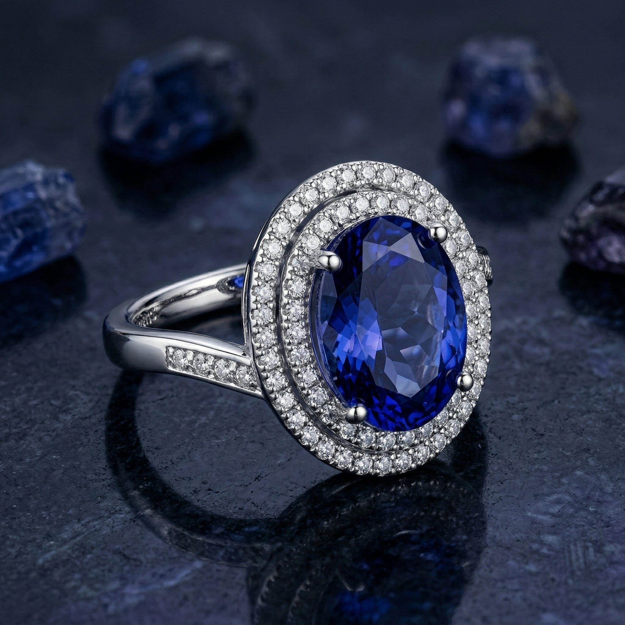 Angled view of the sterling silver oval tanzanite ring highlighting the double halo and stone-set band.