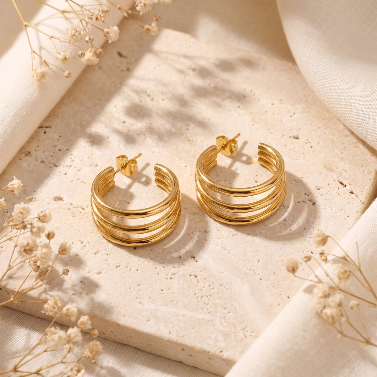 Los pendientes de aro Triple Loop
