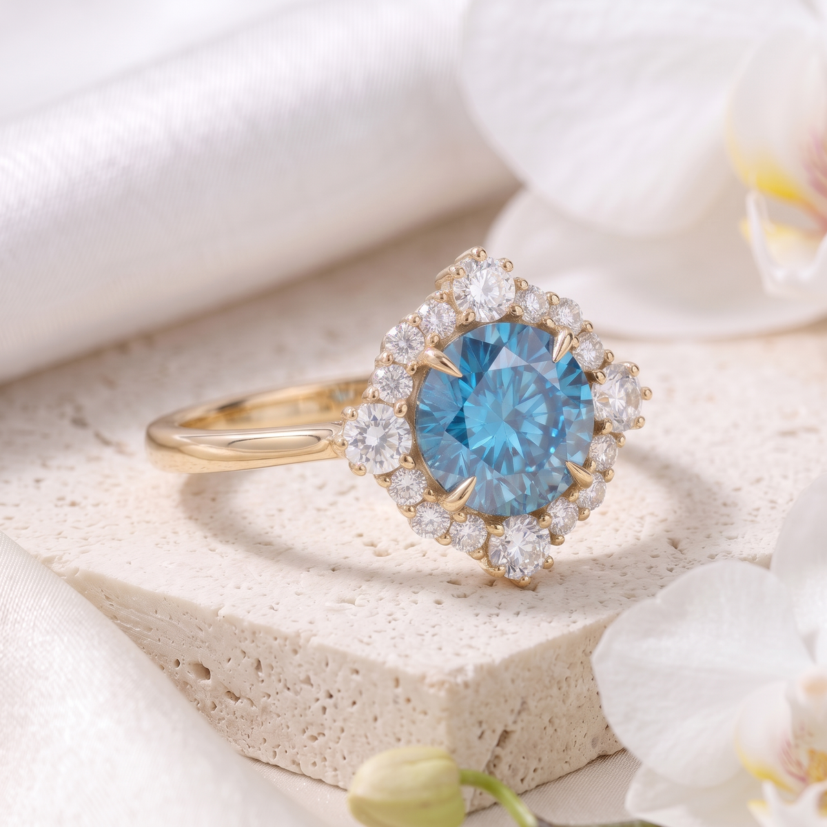 Three-quarter side view of a yellow gold engagement ring featuring a round vibrant blue moissanite center stone with a diamond-pattern halo.