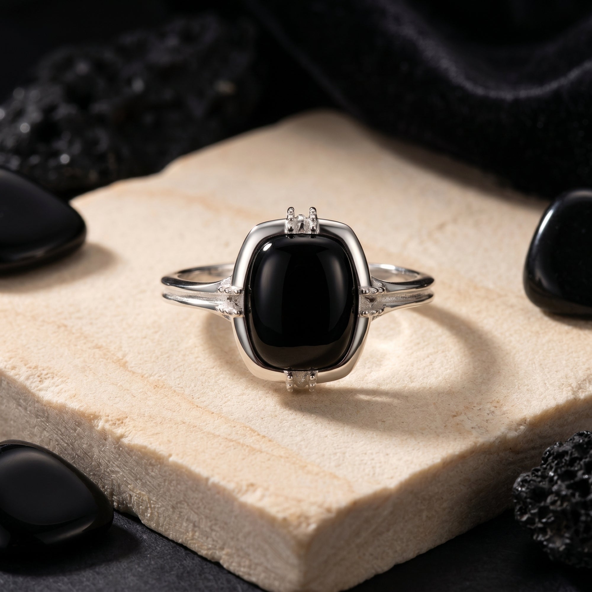 Close-up of the Lyarra natural black onyx cushion cut ring in S925 sterling silver showing the architectural setting.