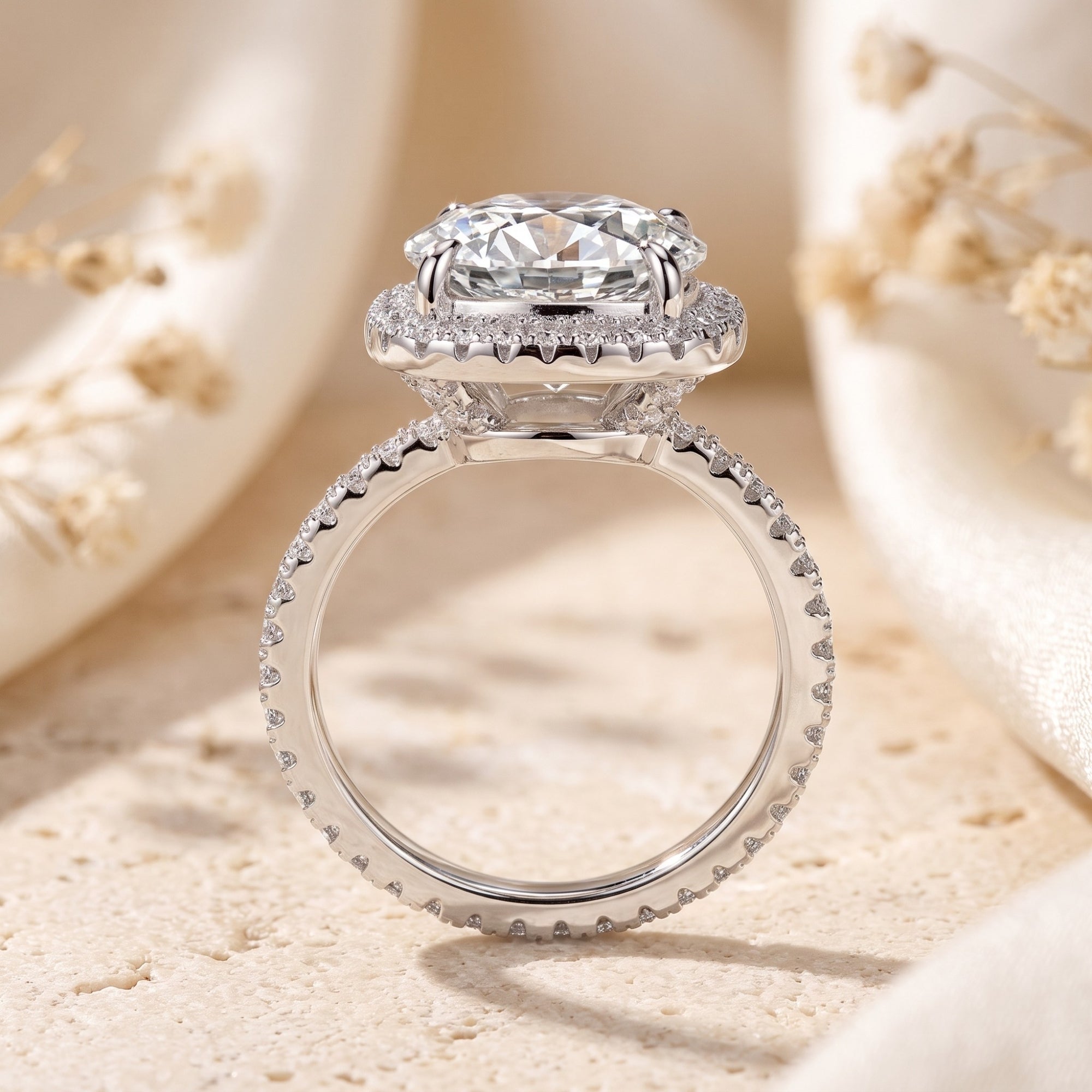Side view of a sterling silver cushion halo ring showing the elevated round brilliant-cut cubic zirconia setting.
