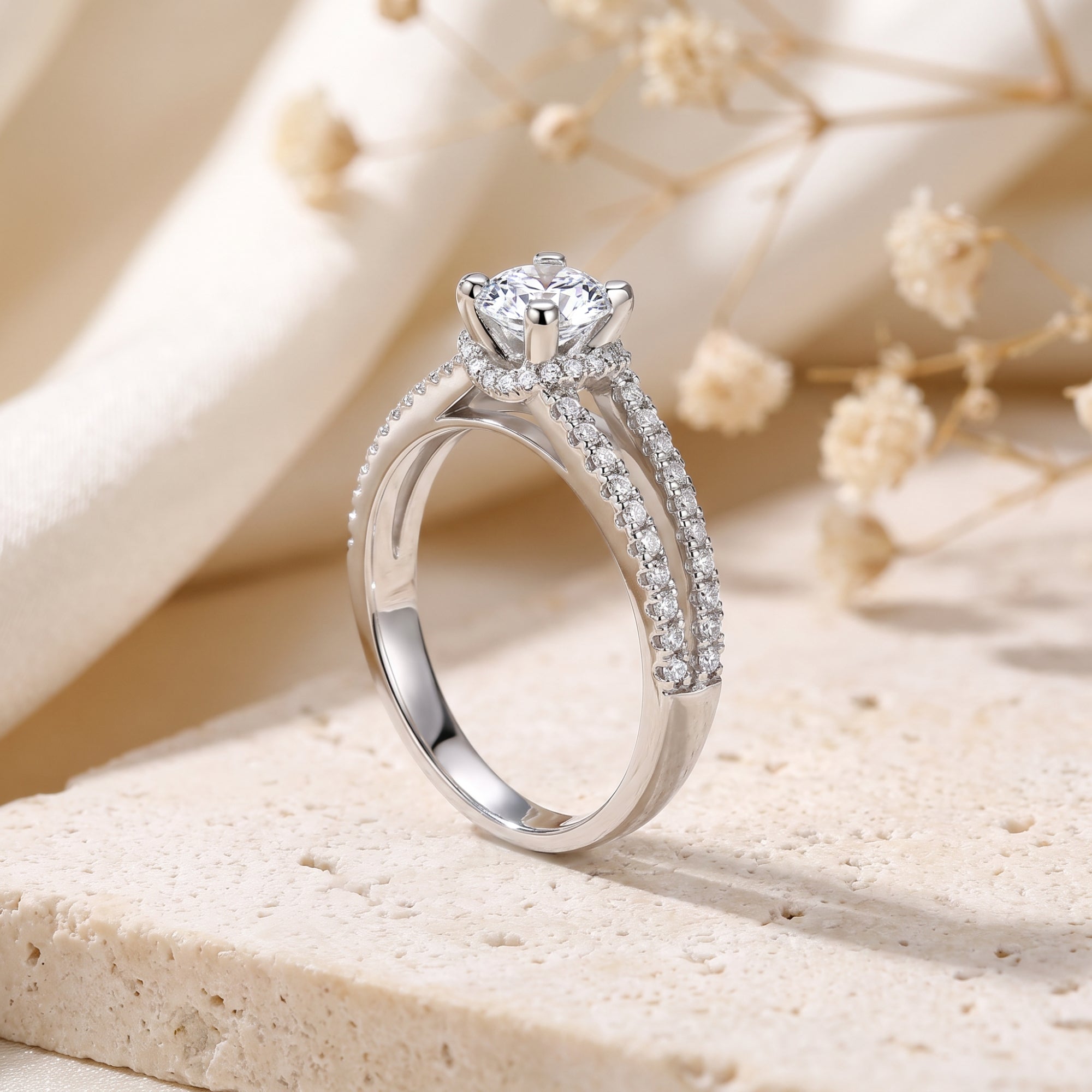 Side profile of the Aria sterling silver split shank ring showing the prong setting and pavé details.