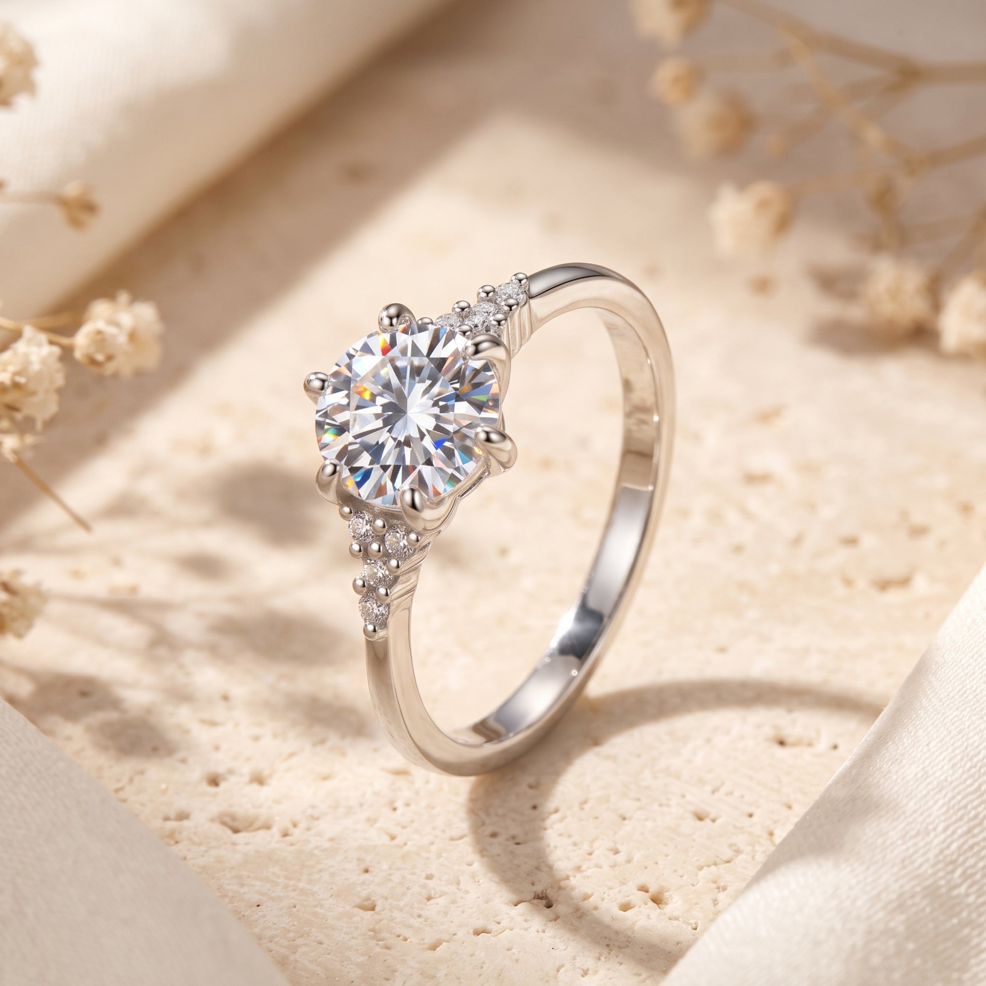 Side profile of sterling silver solitaire ring highlighting the six-prong mount and trefoil clusters.