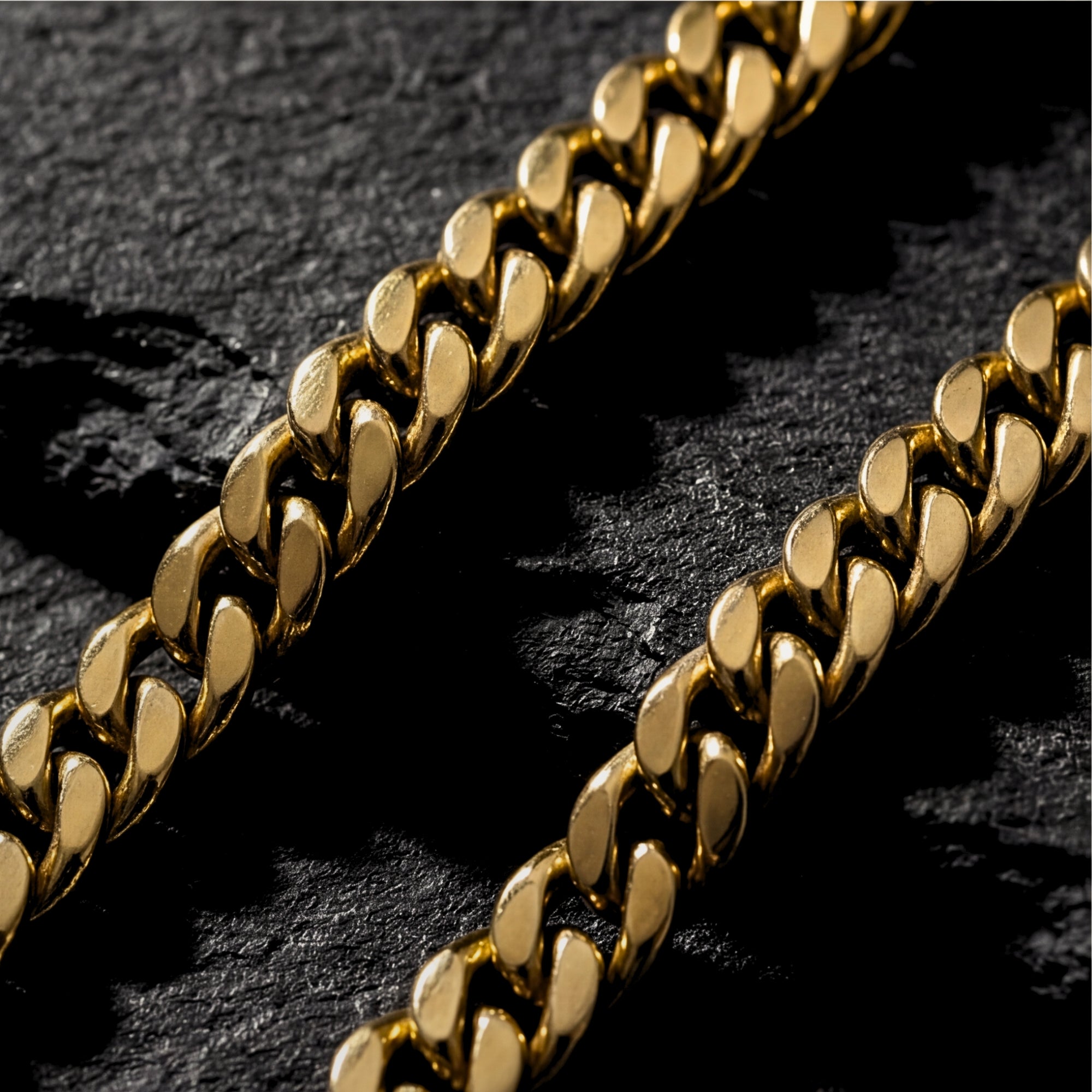 Close-up detail of the 4mm gold stainless steel Miami Cuban links showing the polished finish.