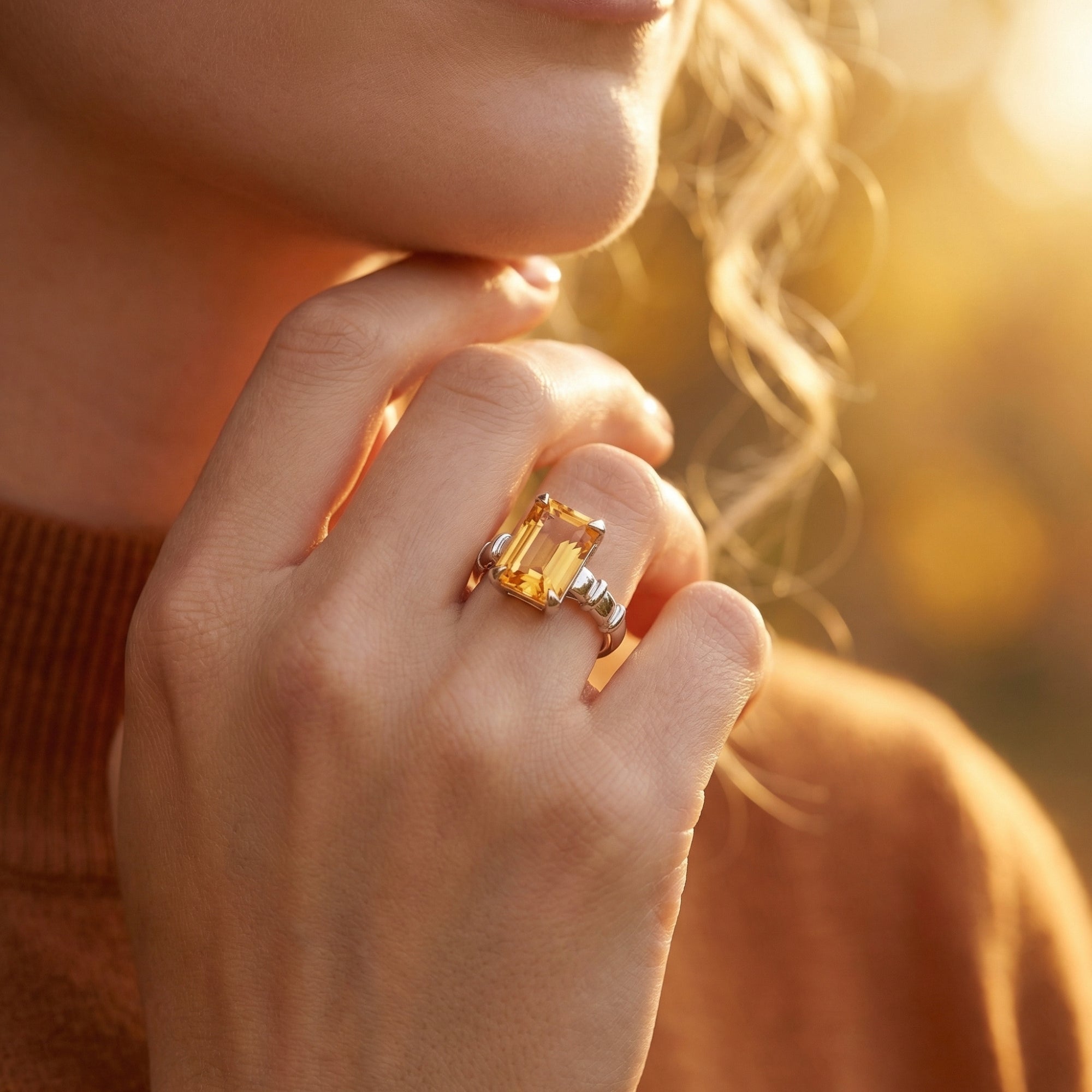 Model wearing the silver Apollonia natural citrine ring, showcasing the emerald cut stone.