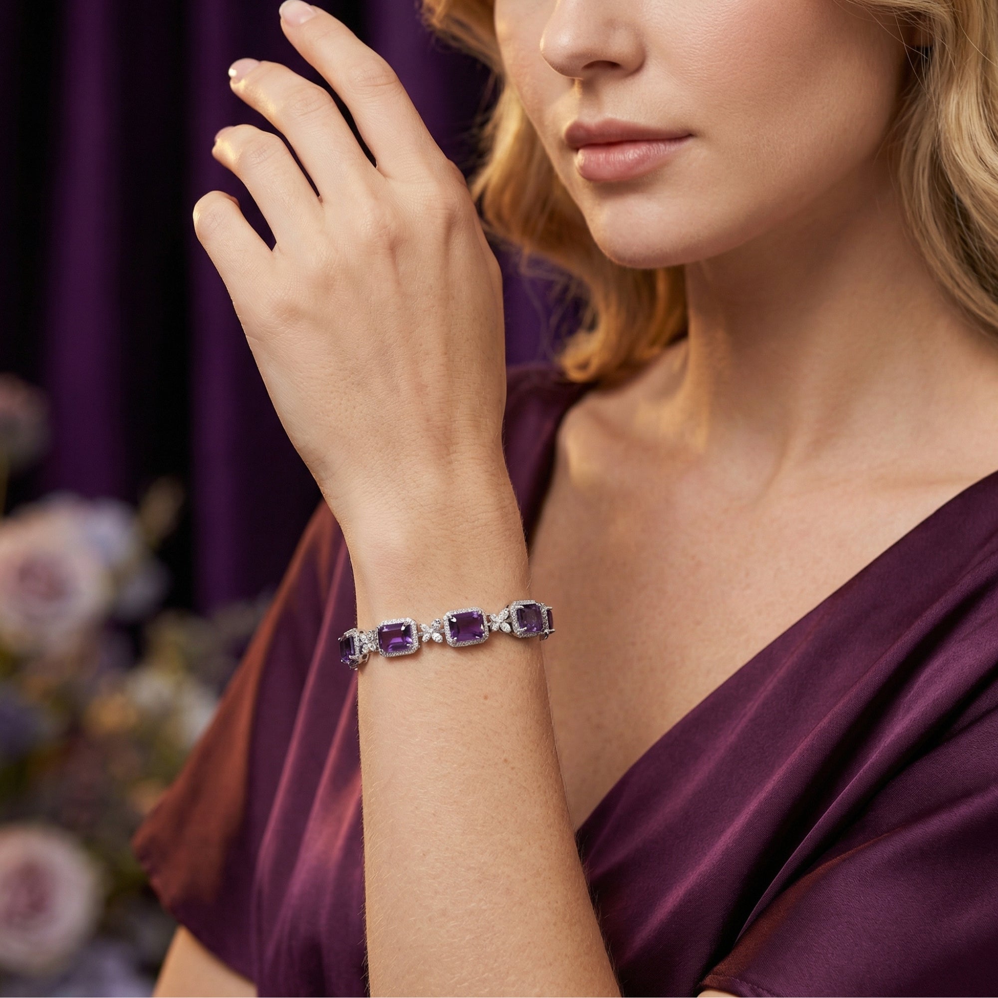 Model wearing the Quintessa S925 sterling silver bracelet with square cut amethysts and a purple silk dress.