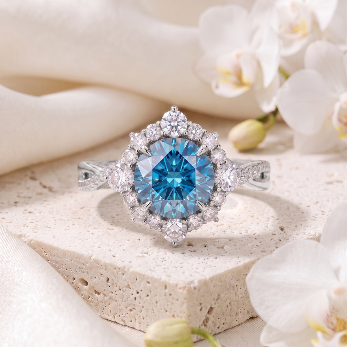 Front view of a white gold halo ring set with a striking blue round moissanite surrounded by sparkling accents.