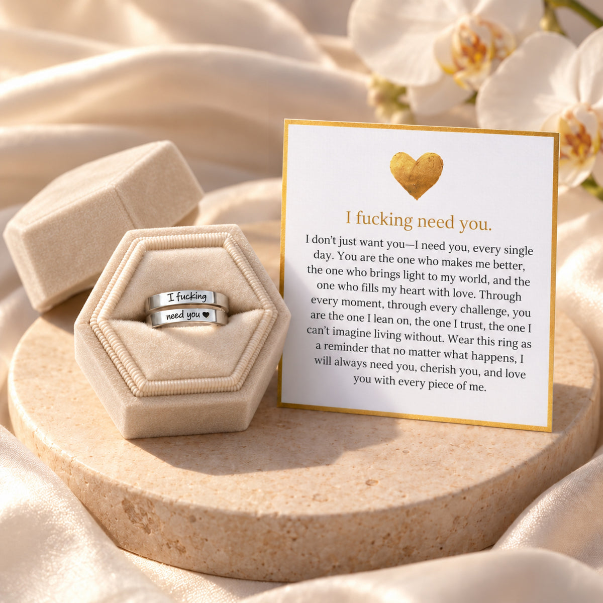 Silver I Need You ring beside its white message card and cream gift box