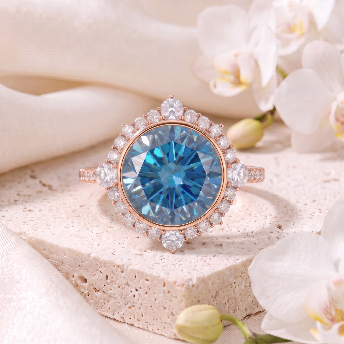 Front-facing view of a round blue moissanite halo engagement ring in rose gold.