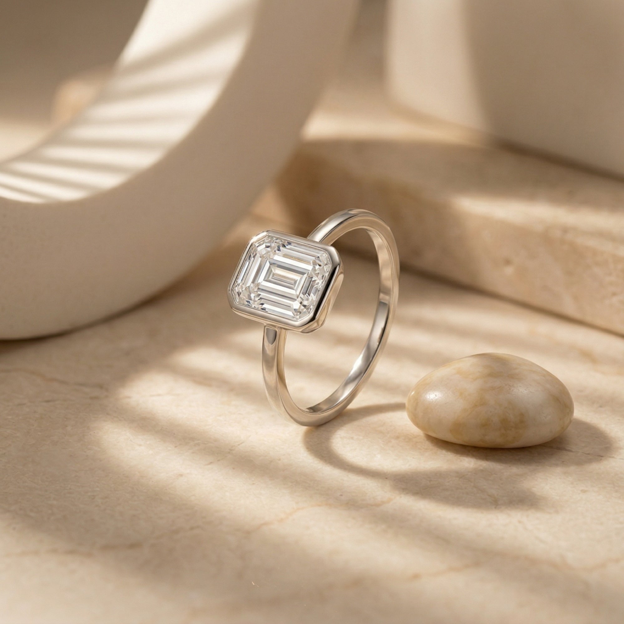 The Astrid Emerald Cut Bezel Ring