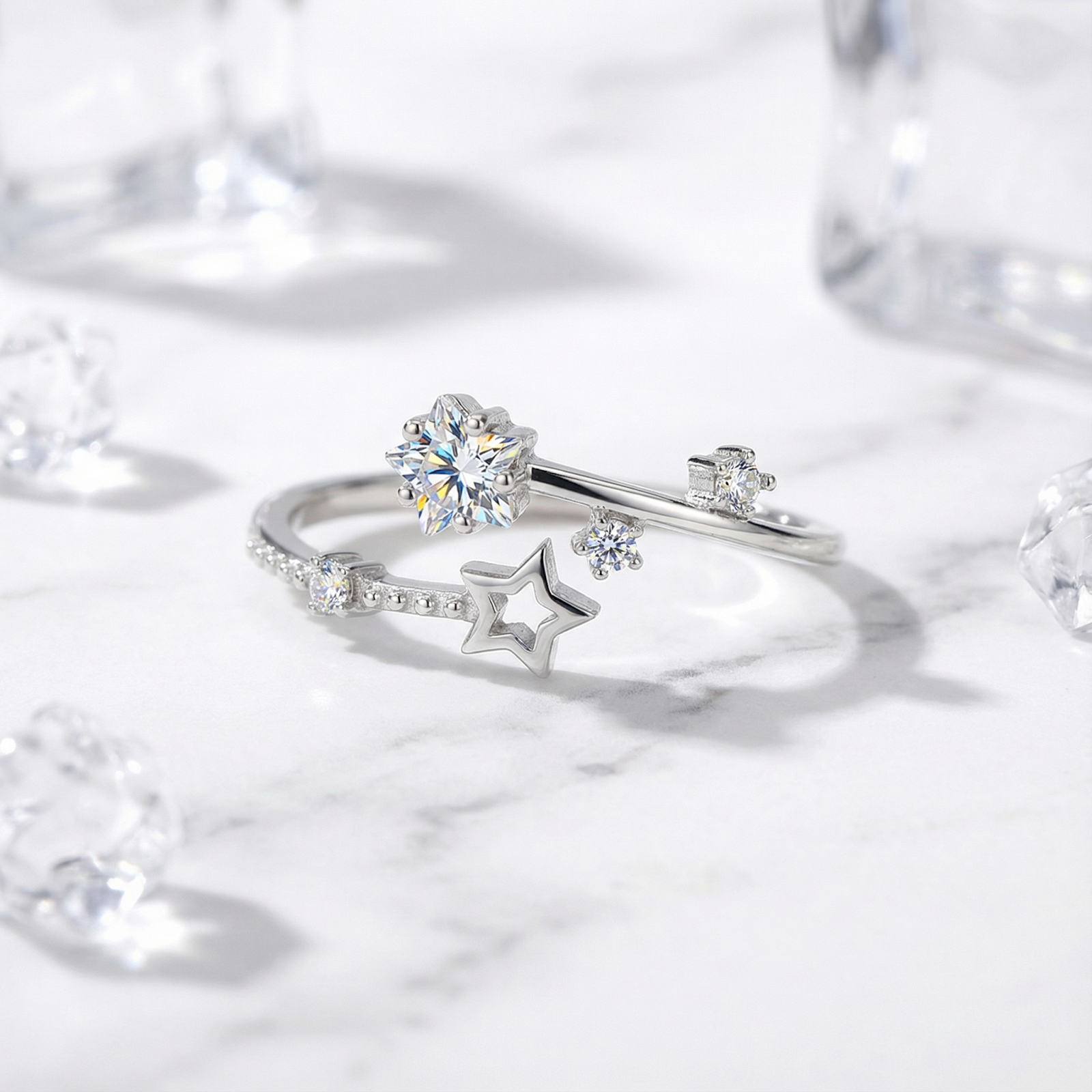 Close-up of the S925 sterling silver celestial bypass ring showing round cut zirconia in star settings.