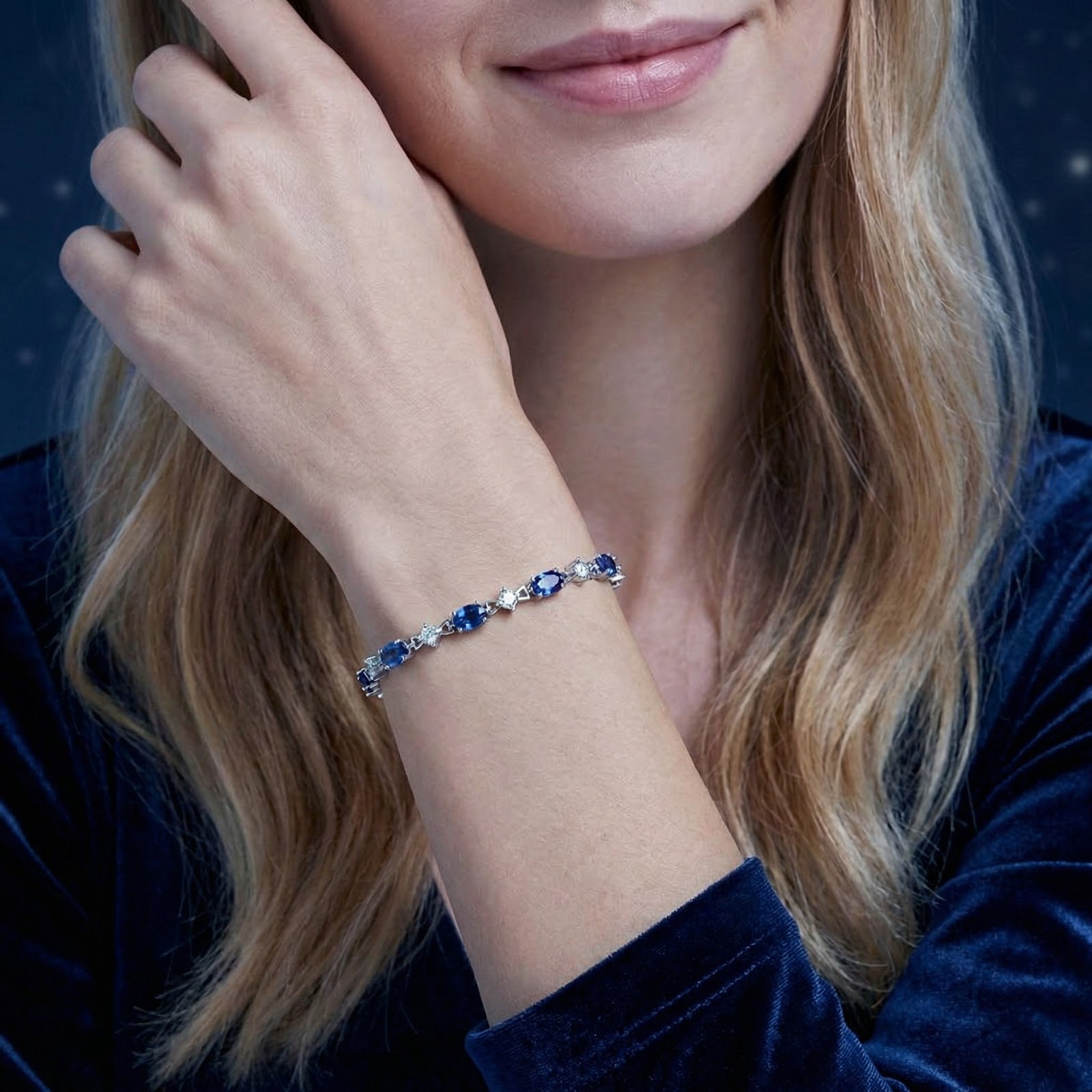 Model wearing the Neriselle oval-cut blue simulated sapphire bracelet in S925 sterling silver on her wrist.