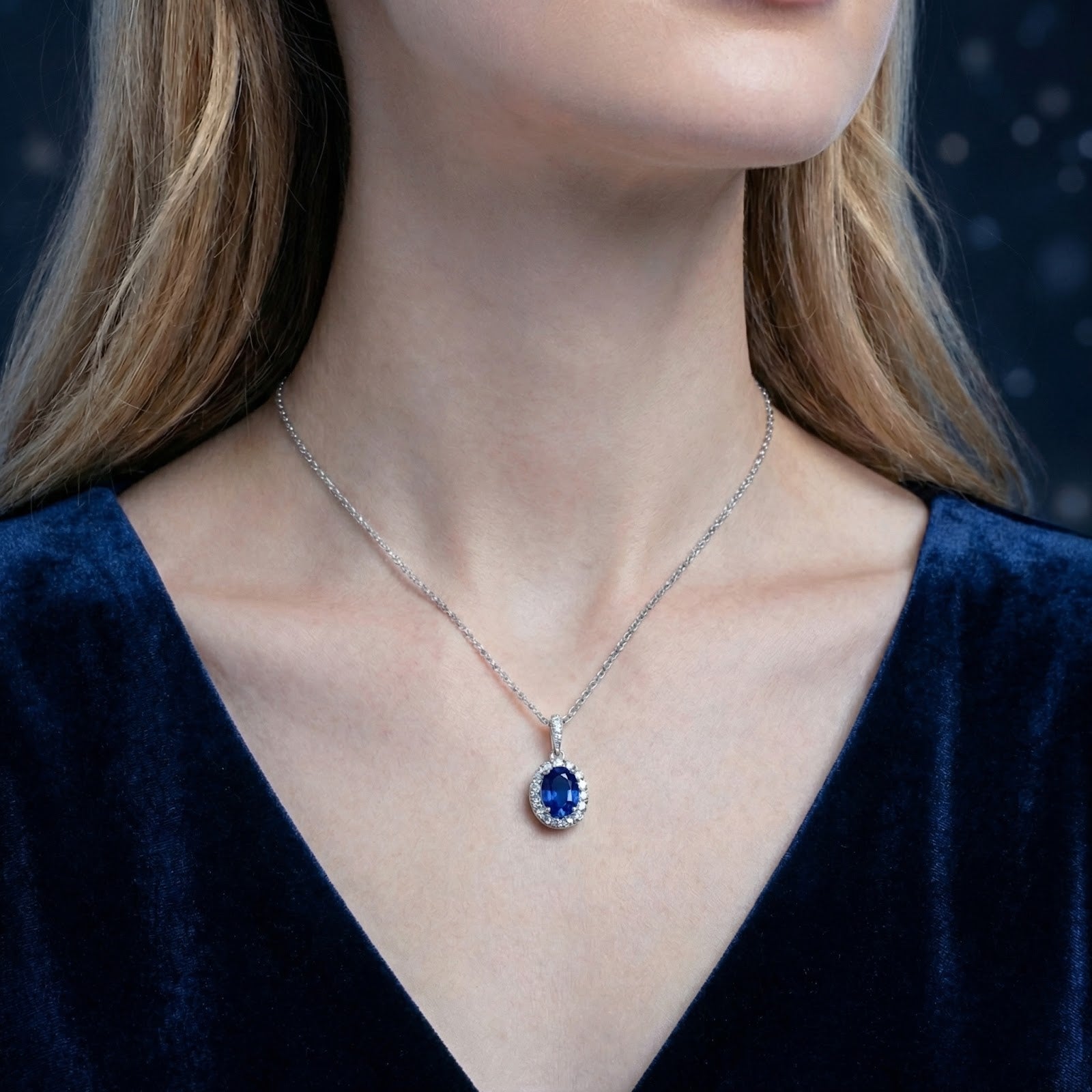 Front view of a model wearing the Serenara Halo simulated sapphire necklace in S925 sterling silver.