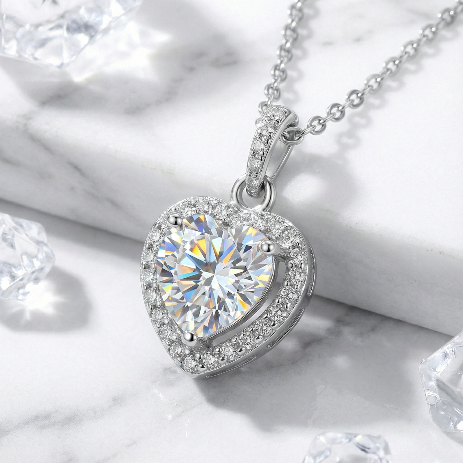 Front view of a heart-shaped simulated diamond pendant with a sparkling halo in sterling silver.