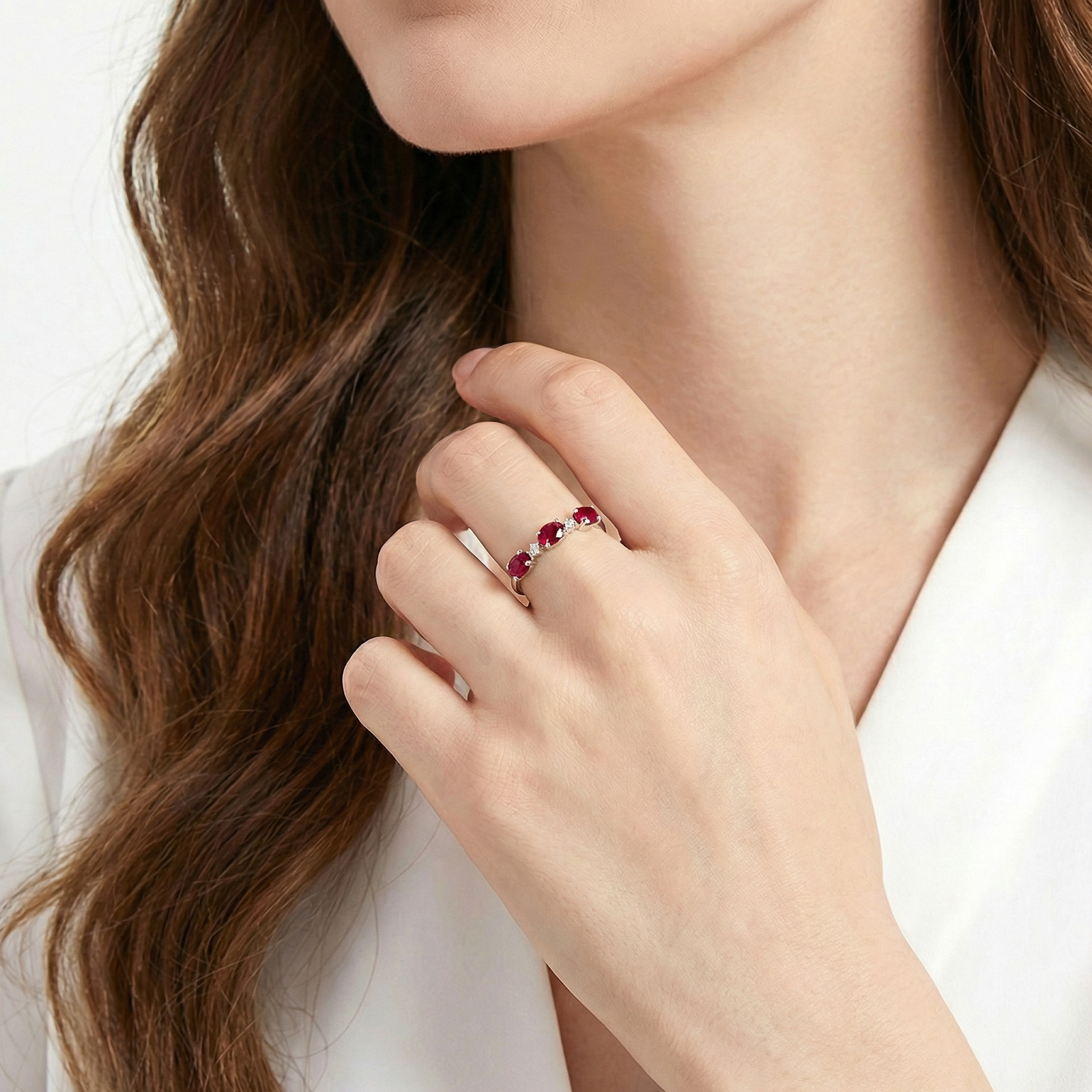 The Thalaraea S925 sterling silver simulated ruby ring worn on a woman's hand.