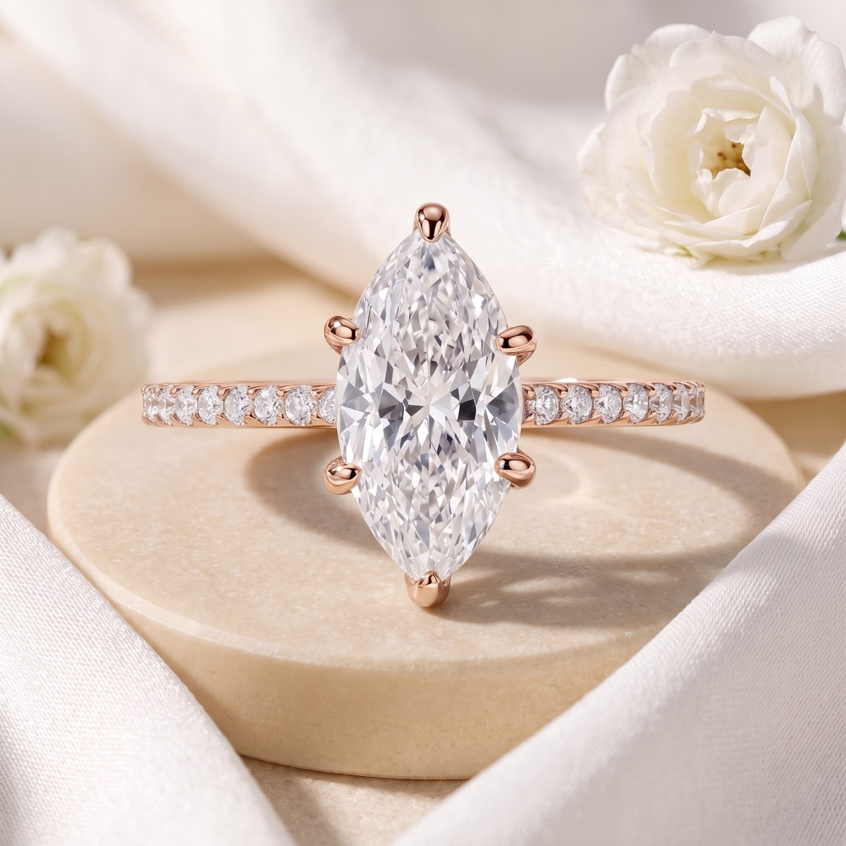 Six-prong marquise moissanite ring in rose gold, front product view.
