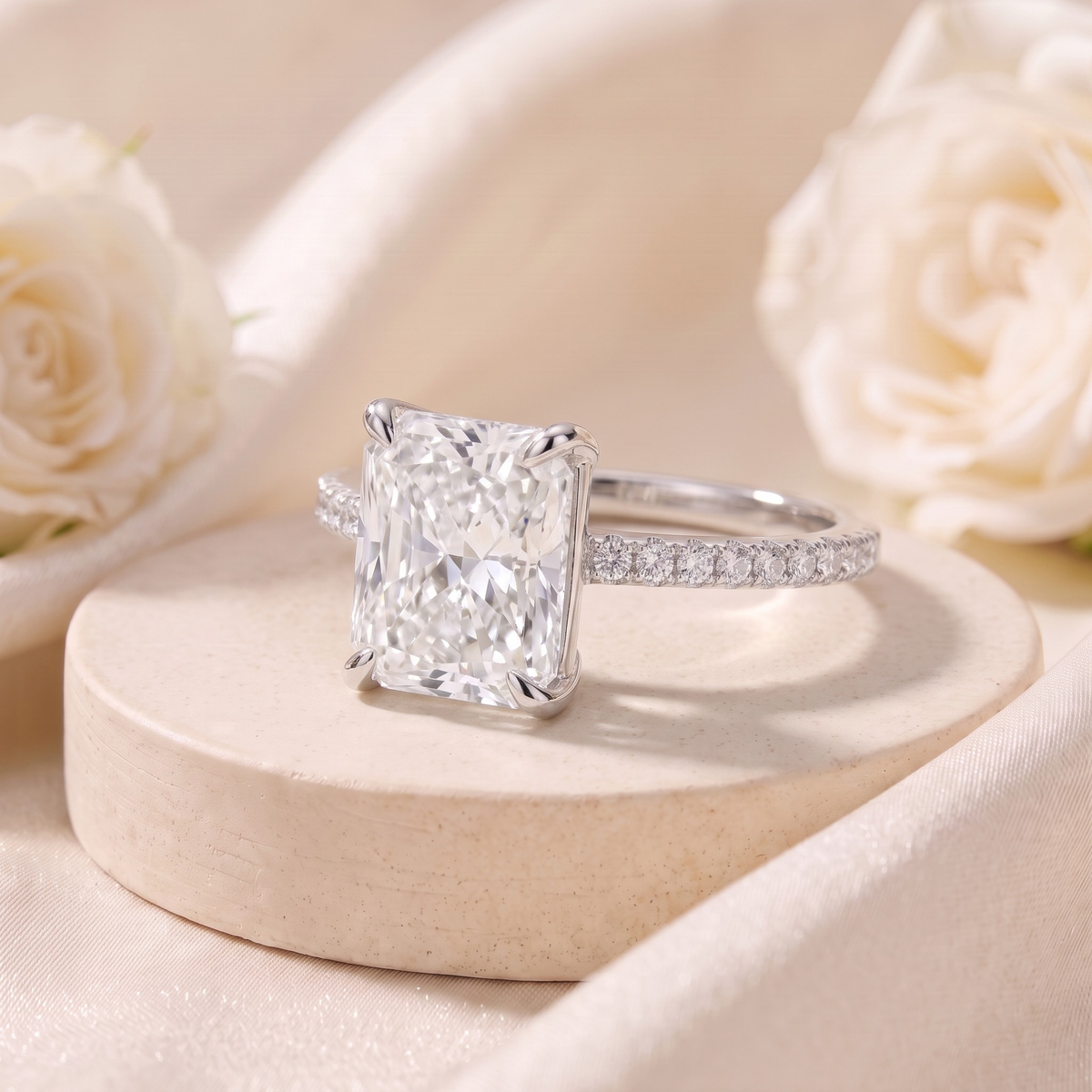 Radiant-cut moissanite ring in silver, angled closeup.