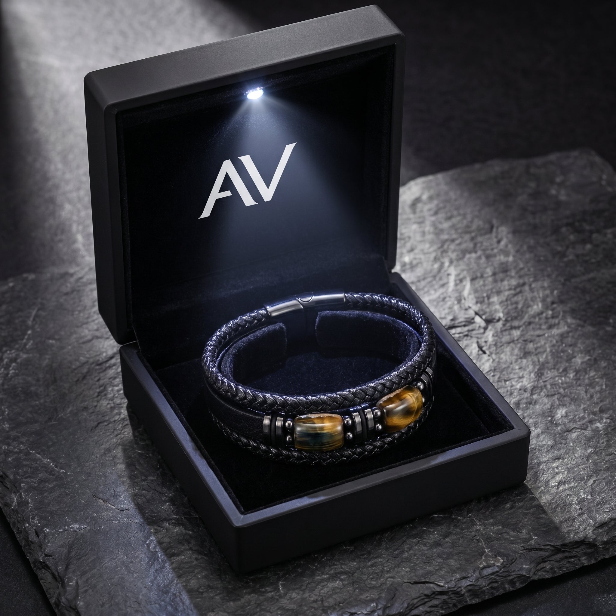 The Crucible black leather and black stainless steel bracelet in a premium lighted presentation box.