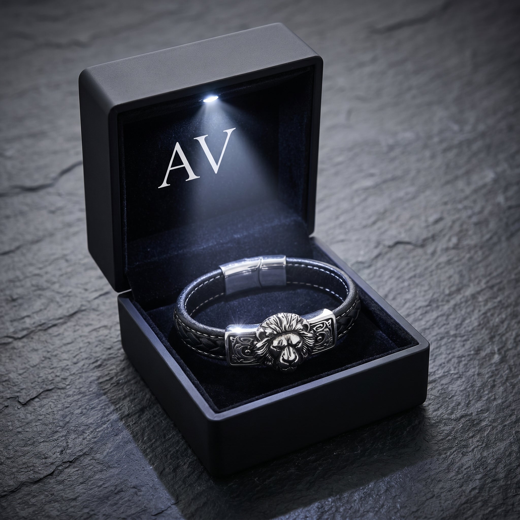 Men's stainless steel lion bracelet inside a premium black LED-lit gift box with AV branding.