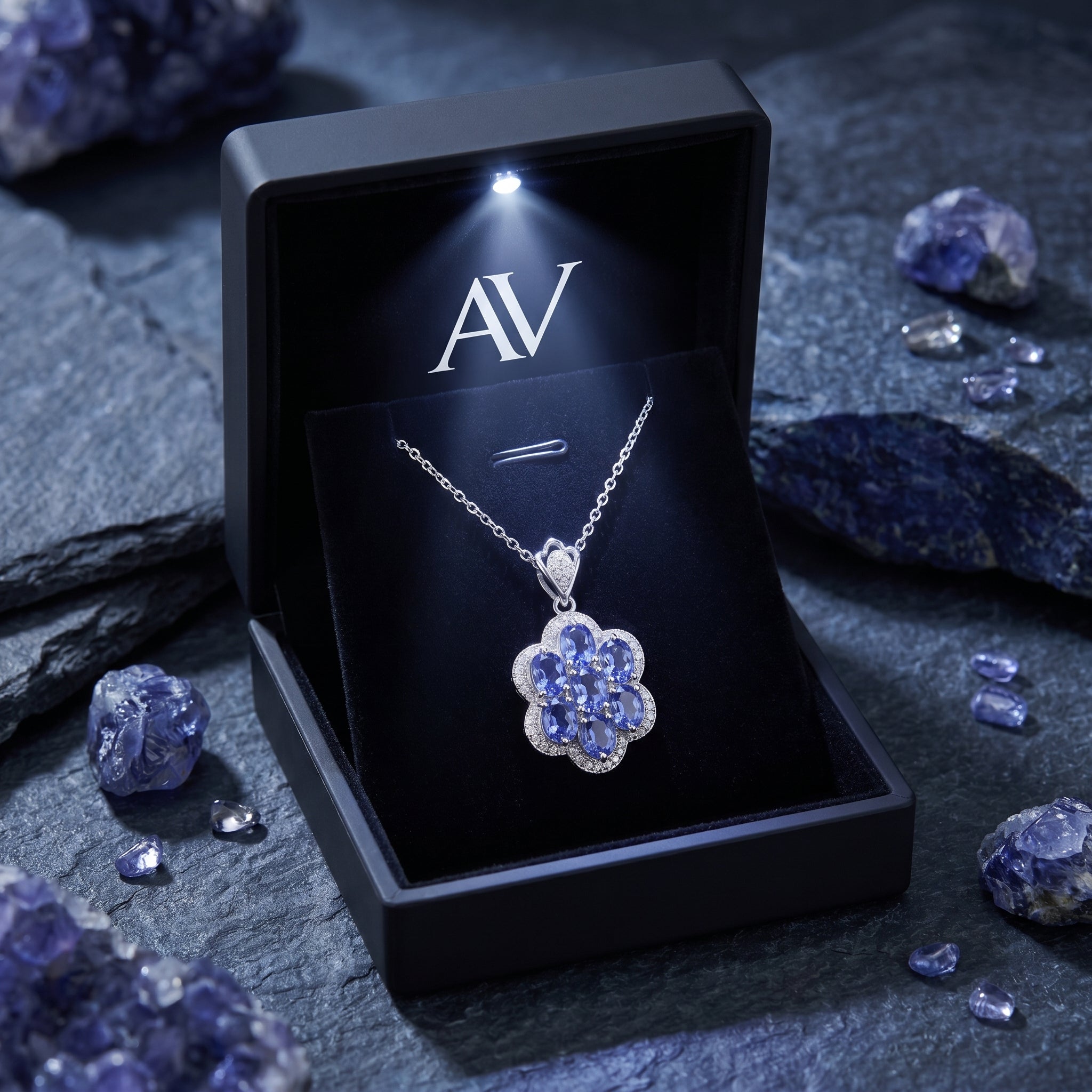 Caelestia tanzanite cluster necklace in a premium black gift box with an integrated LED light and AV logo.