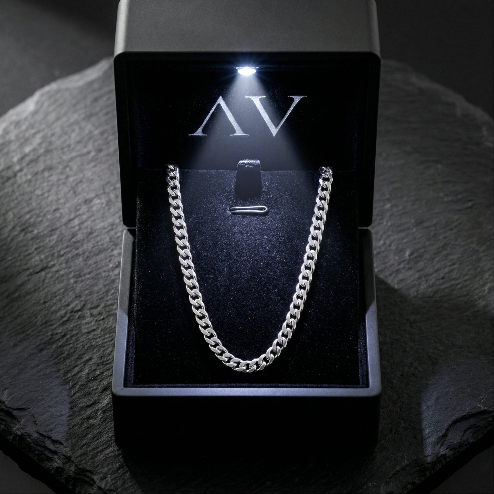 Silver stainless steel Cuban link chain presented in a black LED-lit branded jewelry gift box.