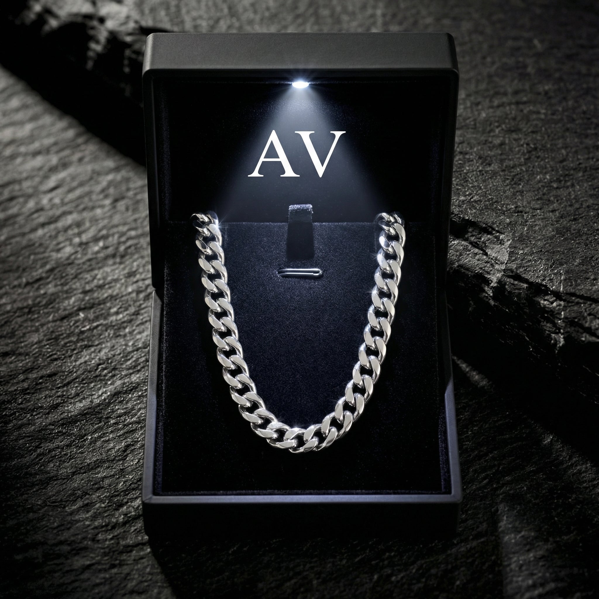 Silver 4mm stainless steel Cuban link chain presented in a black LED-lit gift box.