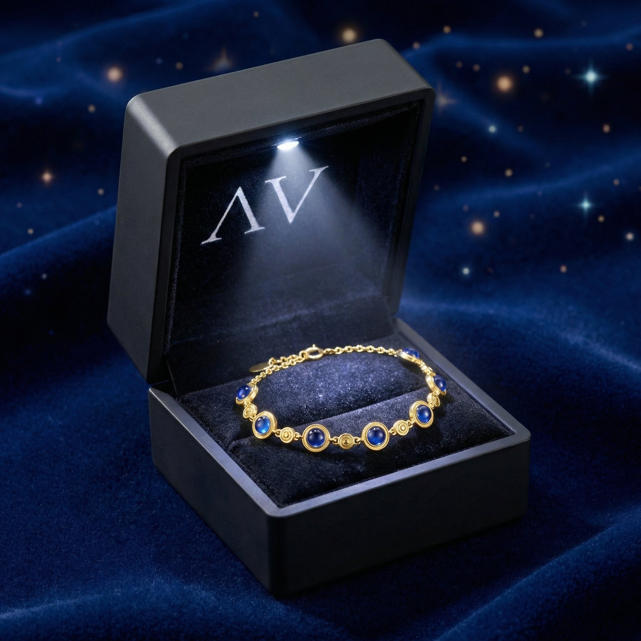 18K gold vermeil simulated sapphire bracelet inside a black LED-lighted jewelry gift box.