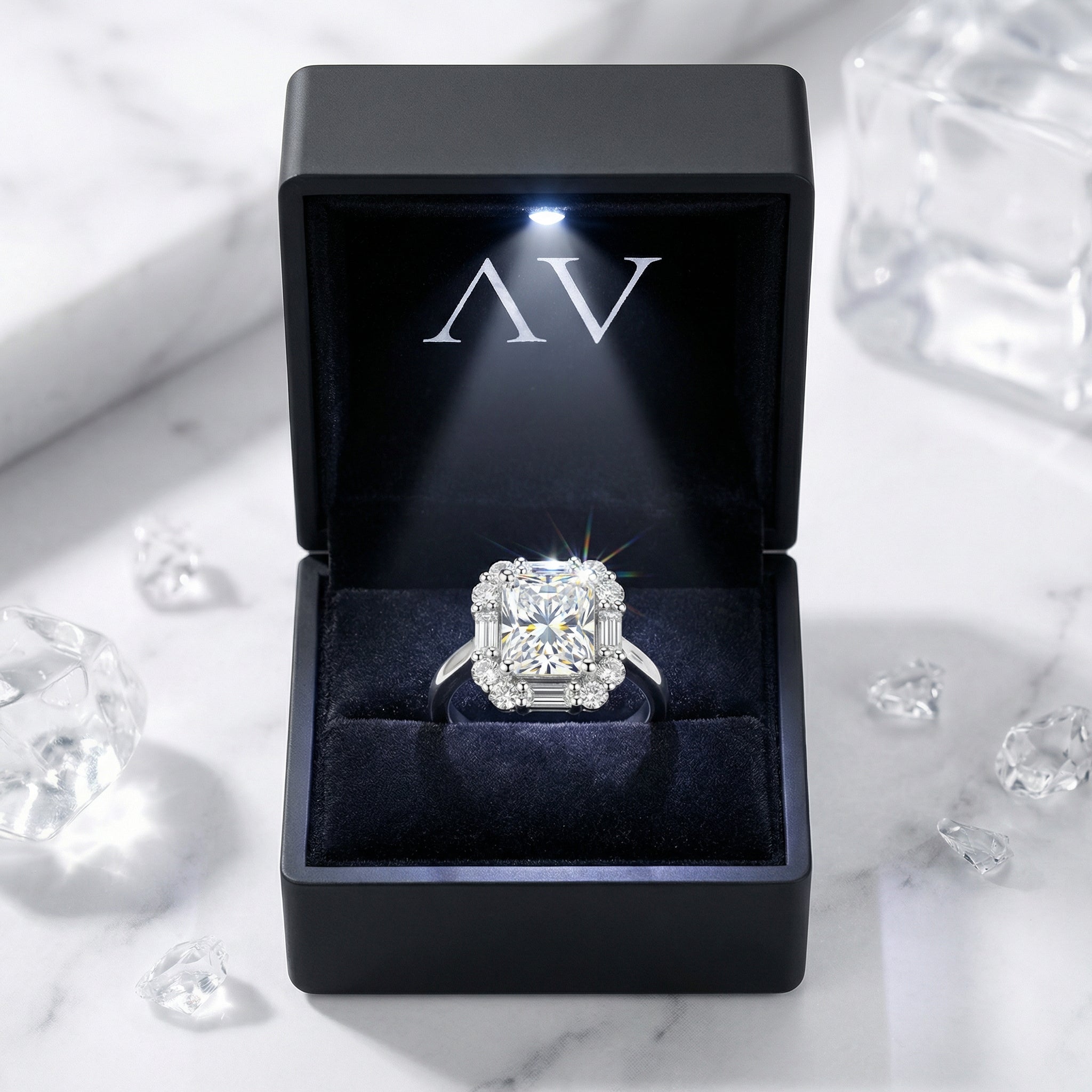 Octagon-cut zirconia halo ring presented in a black LED-lit jewelry box with the AV logo.