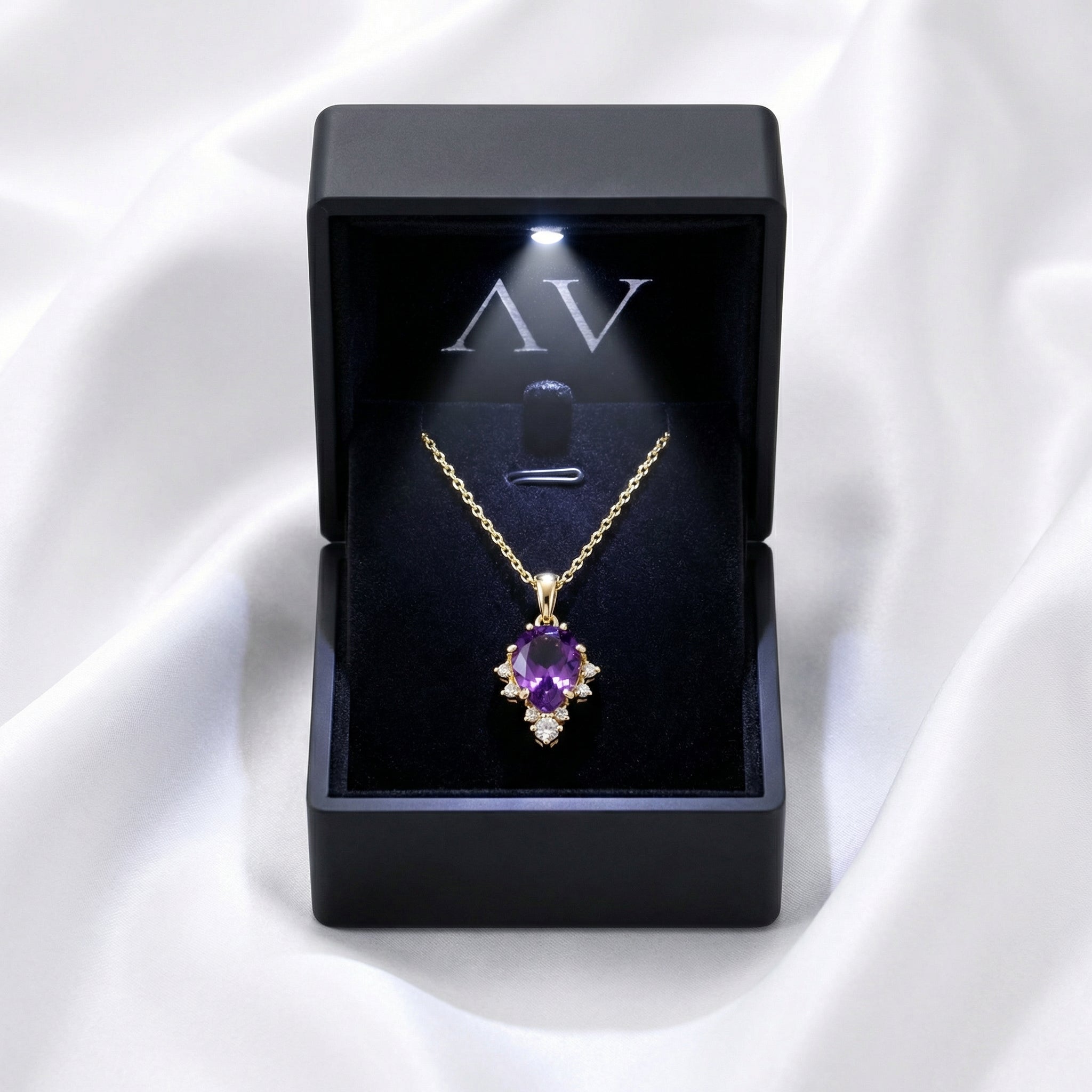 Pear cut simulated amethyst necklace in 18K gold vermeil presented in a lighted black gift box.