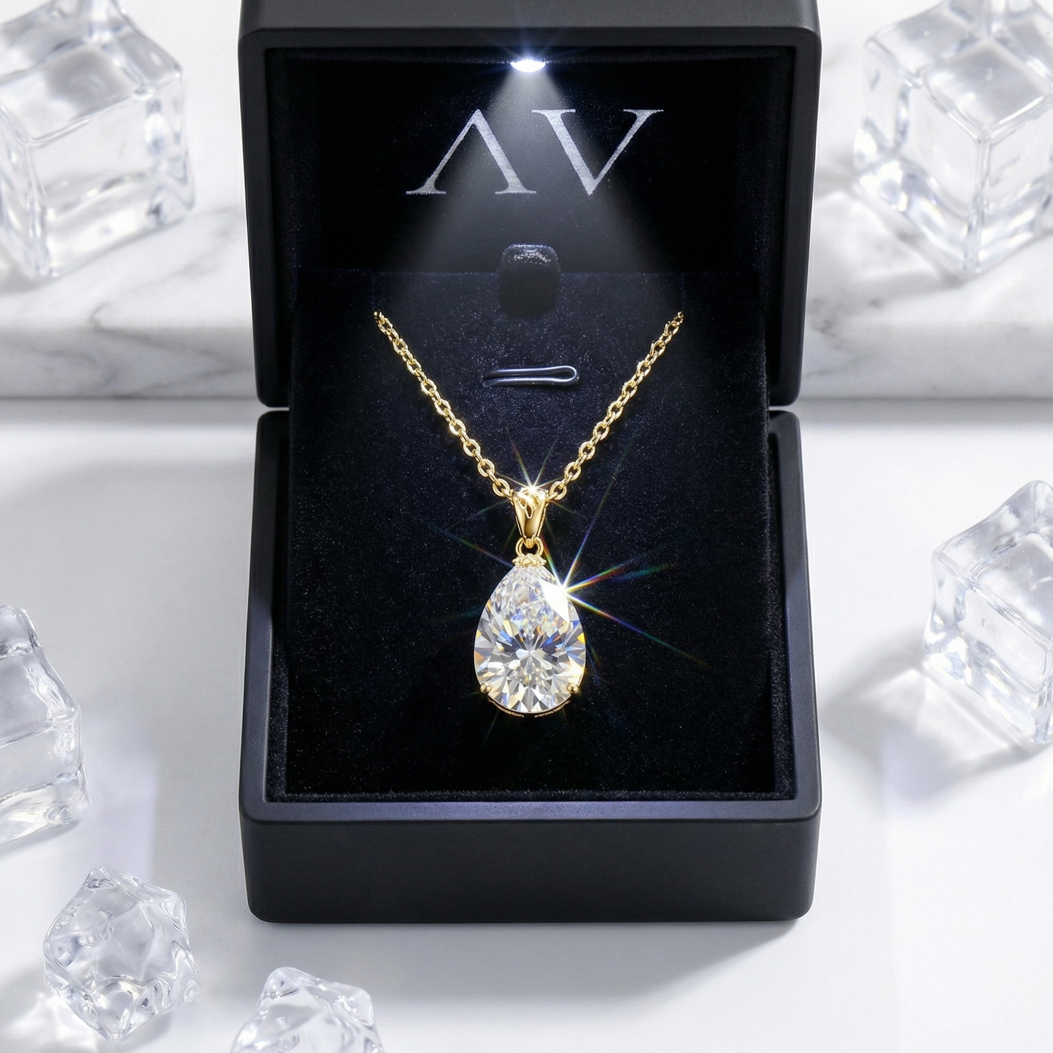 Pear-cut zirconia teardrop necklace in 18K gold vermeil presented in a black LED-lit jewelry gift box.