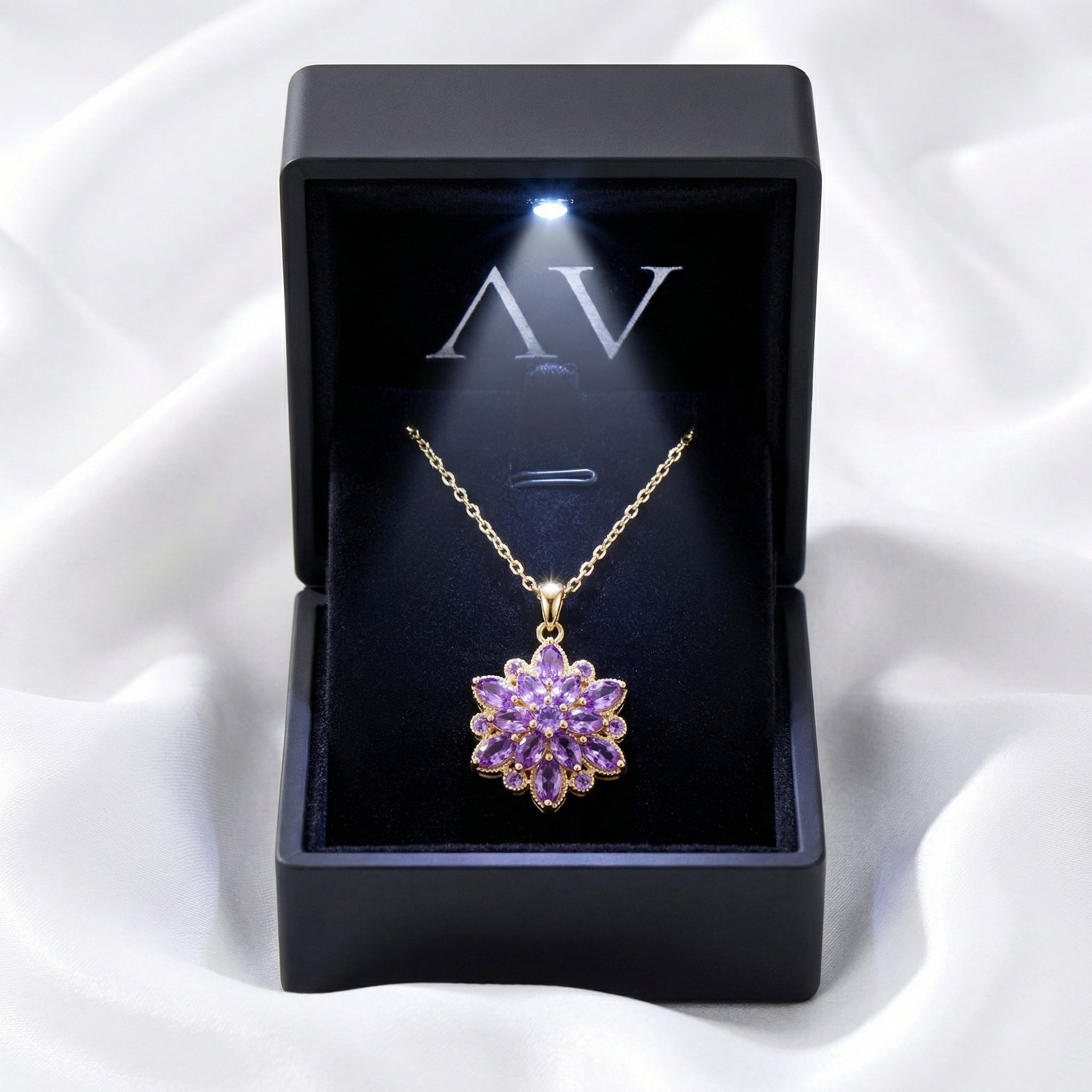 Gold-finished stainless steel Floriana pendant necklace with purple simulated amethyst in a lighted gift box.