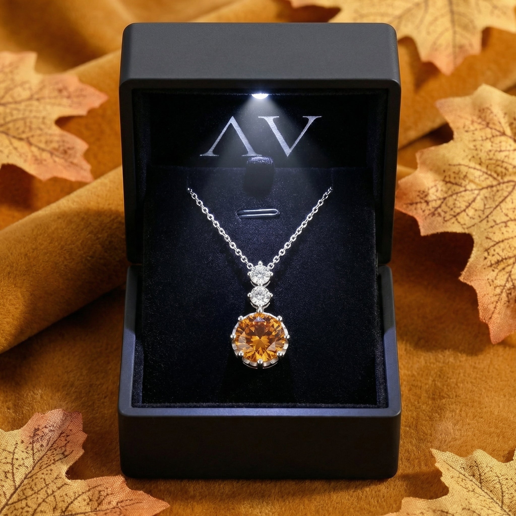Honey topaz sterling silver pendant necklace in a black LED-lighted gift box with autumn leaves.