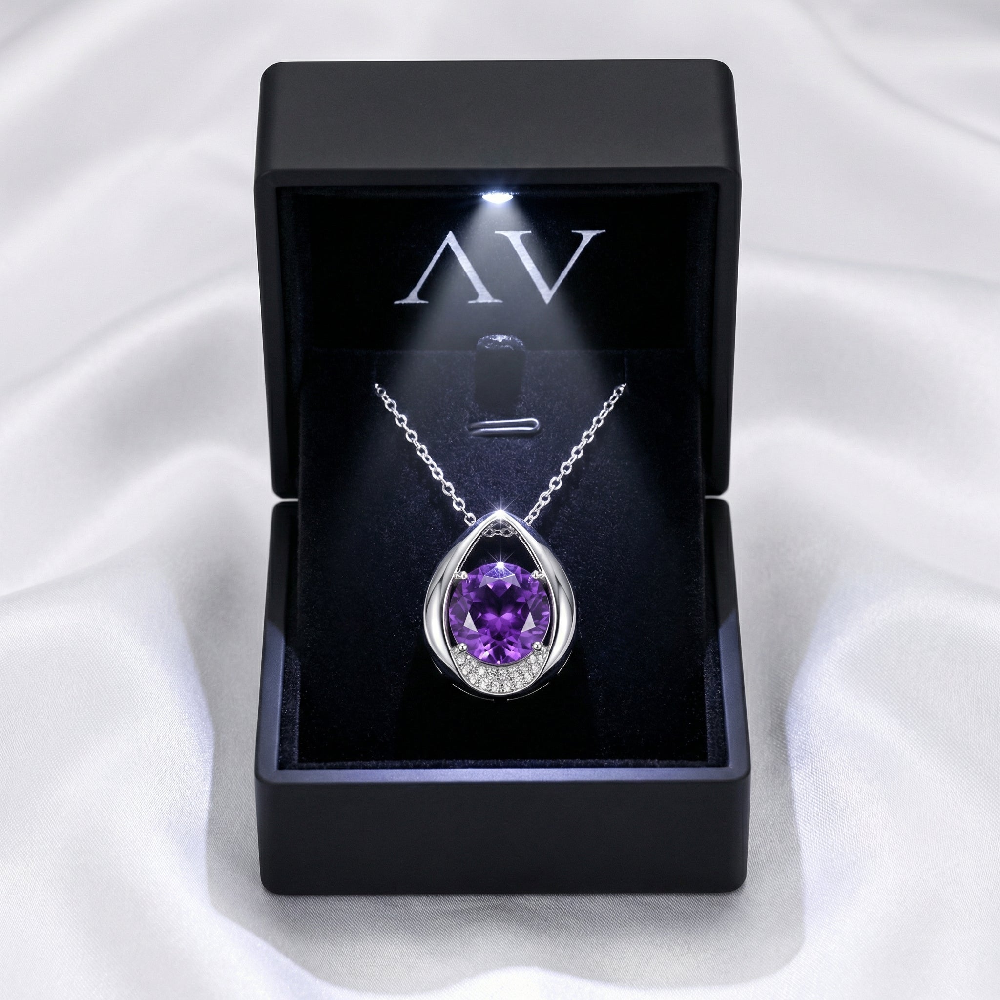 S925 sterling silver amethyst drop necklace presented in a black LED-lit gift box on white silk.